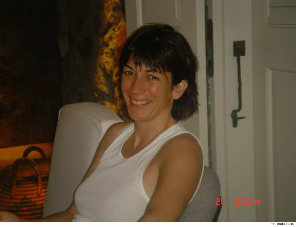 Ghislaine Maxwell, Jeffrey Epstein's accomplice, smiling while wearing a white tank top.