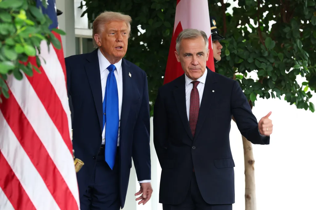 Trump (L) welcomes Canadian Prime Minister Mark Carney outside the West Wing of the White House on October 07, 2025 in Washington, DC.
