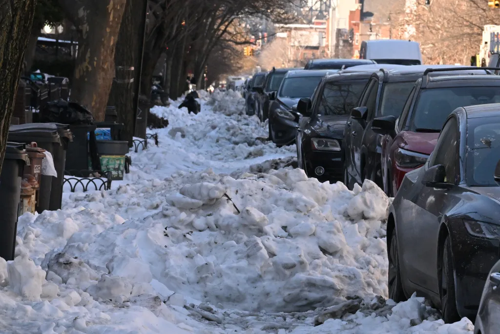 Bike lanes covered by snow on 9th street between Prospect Park West and 4th Avenue in Park Slope Brooklyn.