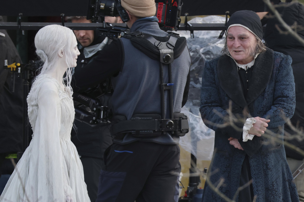 Johnny Depp in character as Ebenezer Scrooge, alongside Andrea Riseborough on the set of 