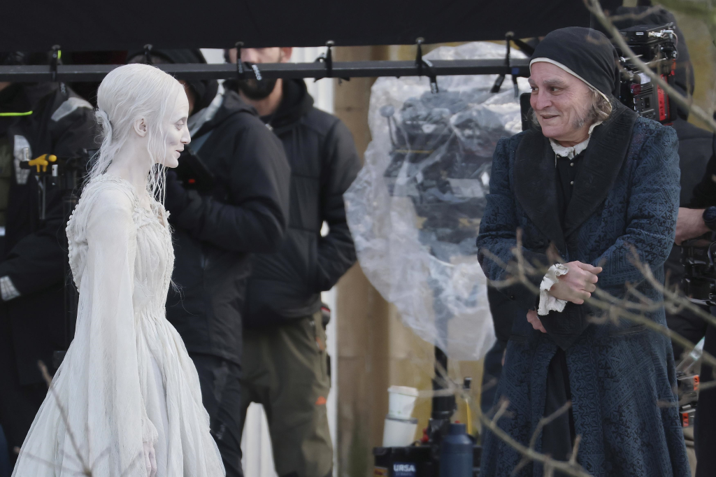Andrea Riseborough as a ghostly character and Johnny Depp as Scrooge on the set of 