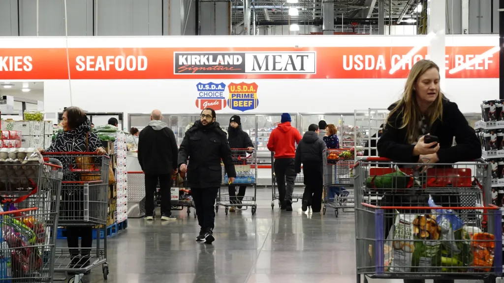 Customers stock up on food and household supplies at Costco ahead of a major winter storm.