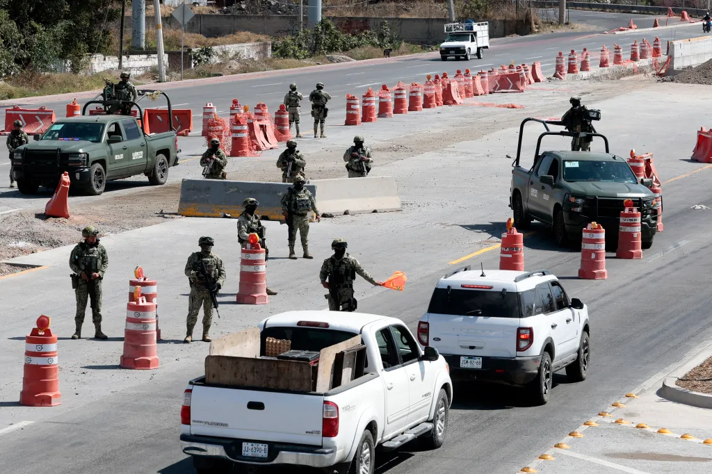 Mexican troops stationed at the access roads to the Guadalajara International Airport on Feb. 22, 2026.
