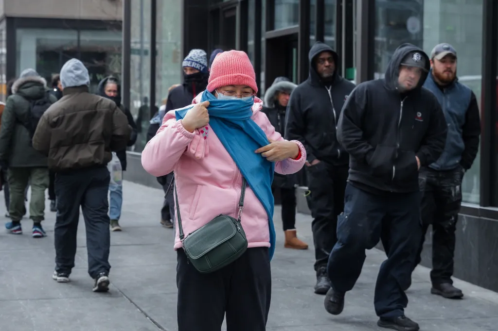 A pedestrian bundles up in winter clothing during low temperatures in New York.