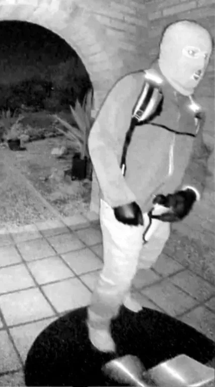 An armed, masked individual captured on video outside Nancy Guthrie's home on Feb. 1, 2026.