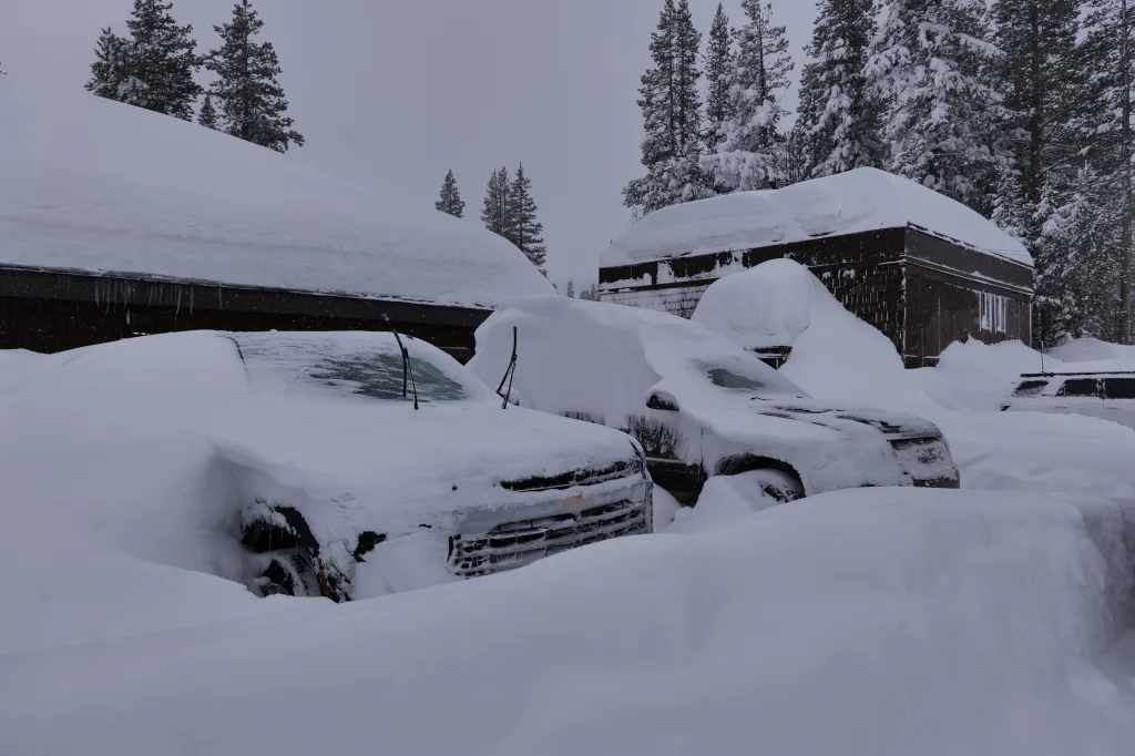 Snow-covered cars buried in a Tahoe avalanche area.