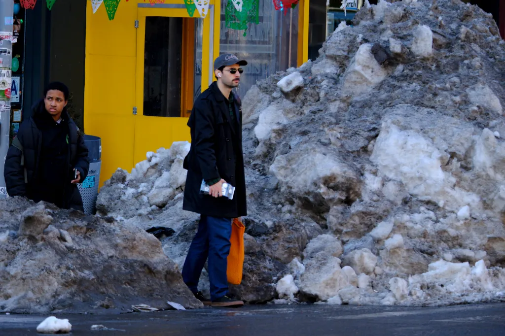 A pile of ice taller than a person sits at Ninth Avenue and West 50th Street in Midtown Manhattan, New York City, on Wednesday afternoon, February 4, 2026, ten days after Winter Storm Fern dumped more than a foot of snow on the region. 