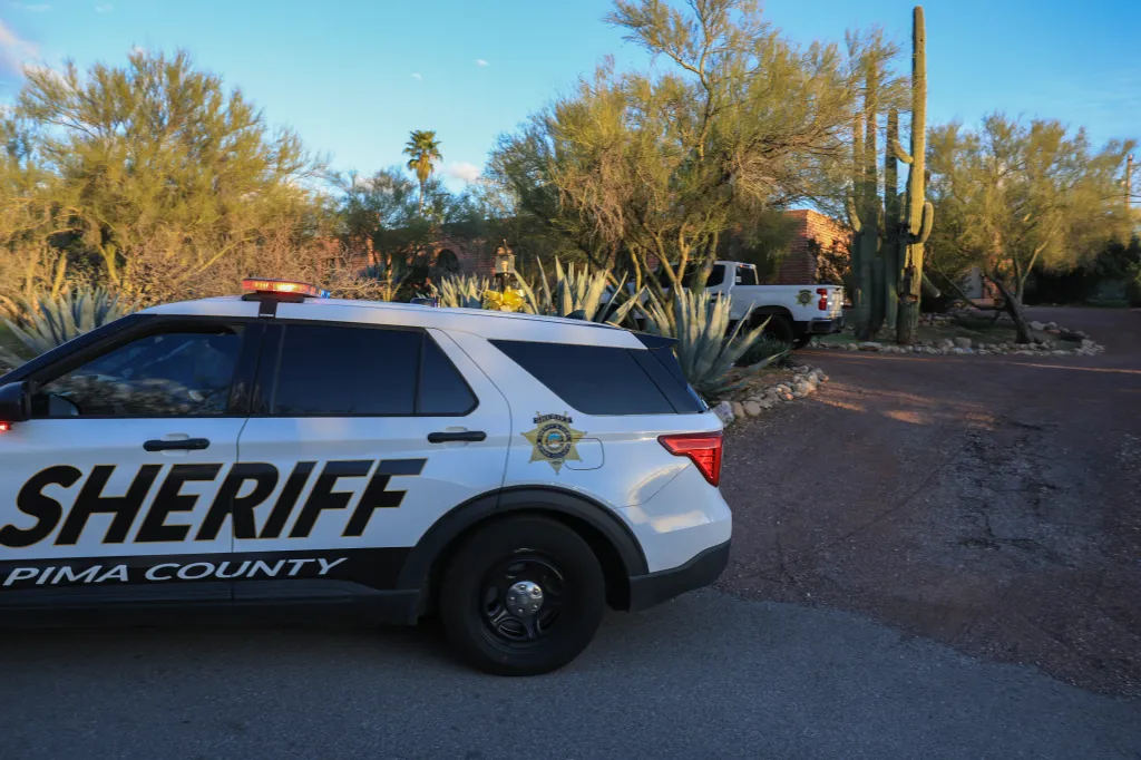 Pima County Sheriff's vehicles parked outside Nancy Guthrie's residence in Tucson, Arizona.