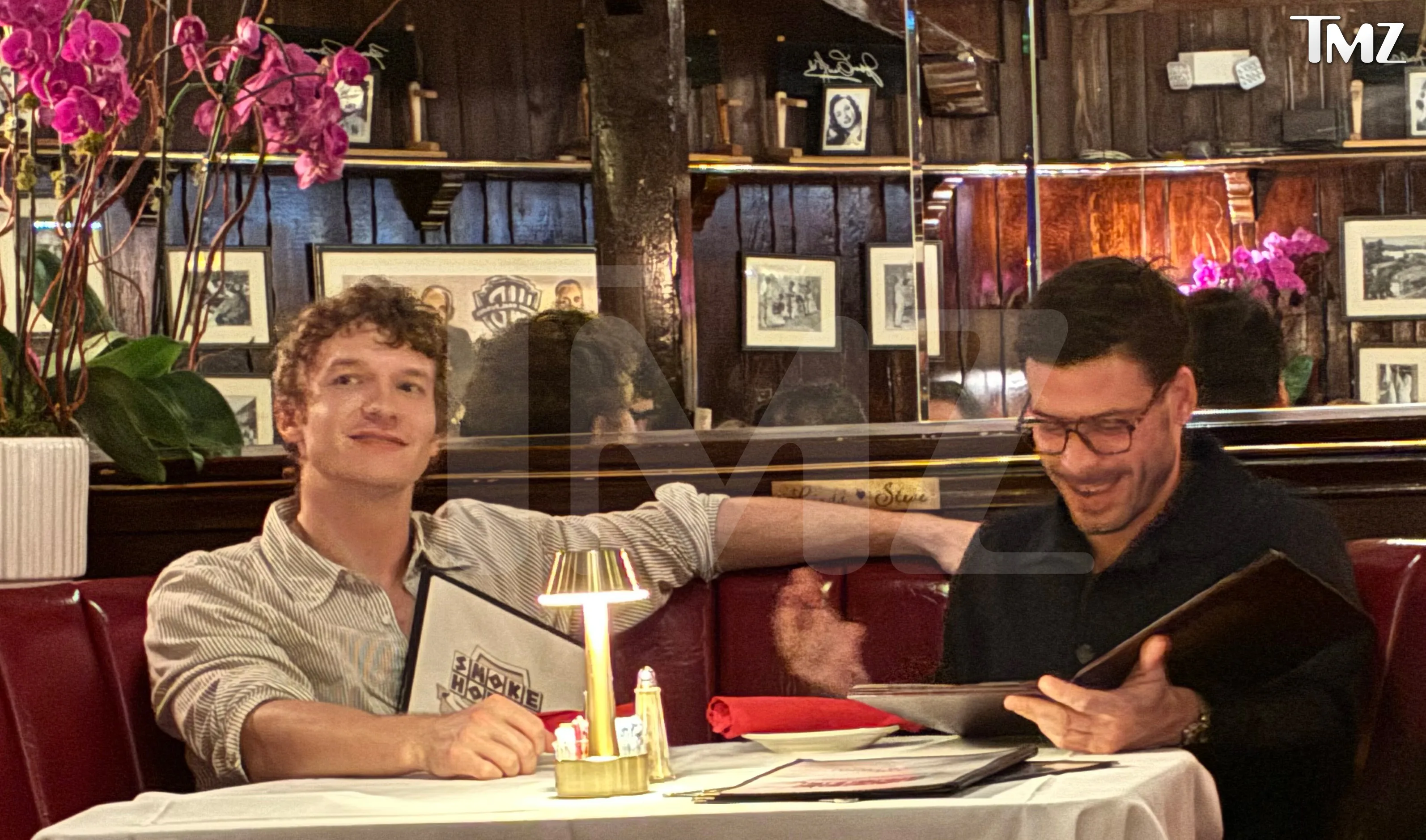 Connor Storrie and Francois Arnaud sharing a booth at Smoke House restaurant.