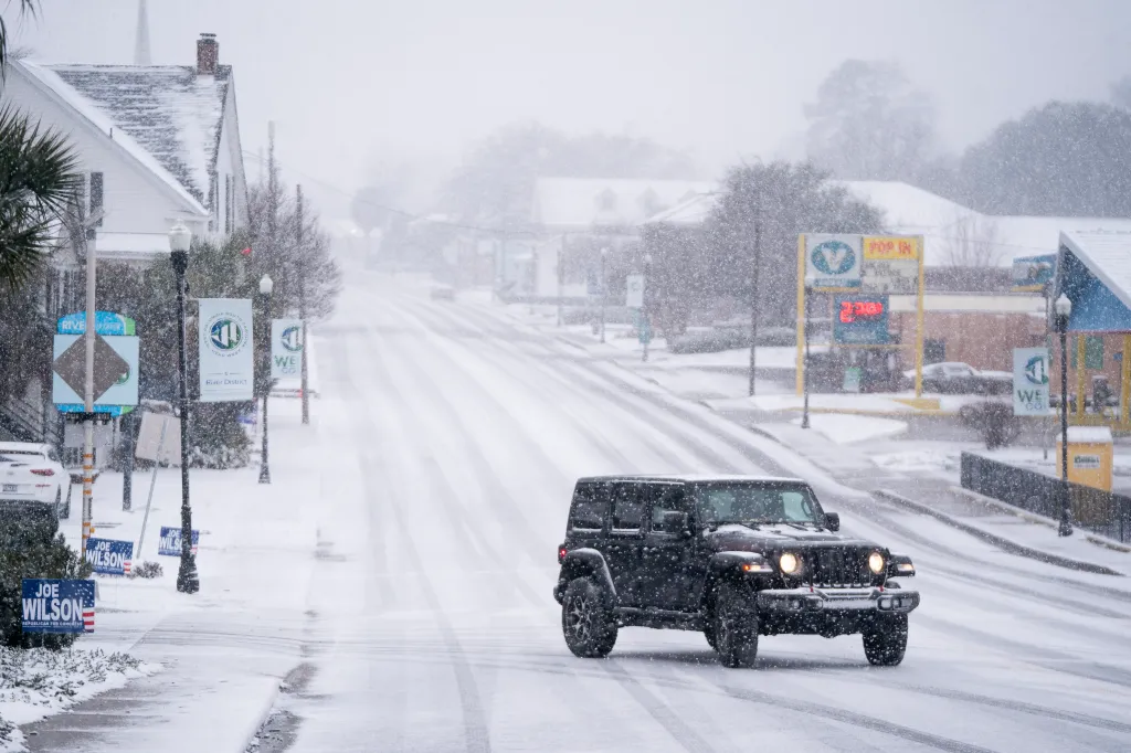 A driver attempts to drive down a road during a winter storm In West Columbia, South Carolina, on Jan. 31, 2026.