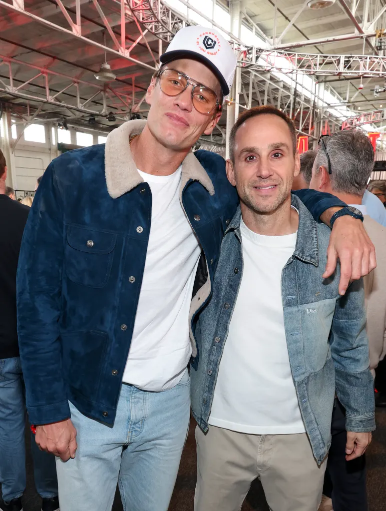Chase Stokes and Michael Rubin posing together.
