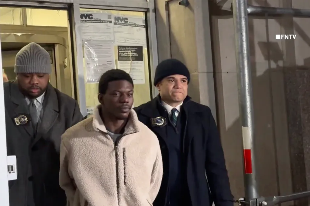 Germaine Parham is escorted out by law enforcement after his arrest in Manhattan on Feb. 3, 2026.