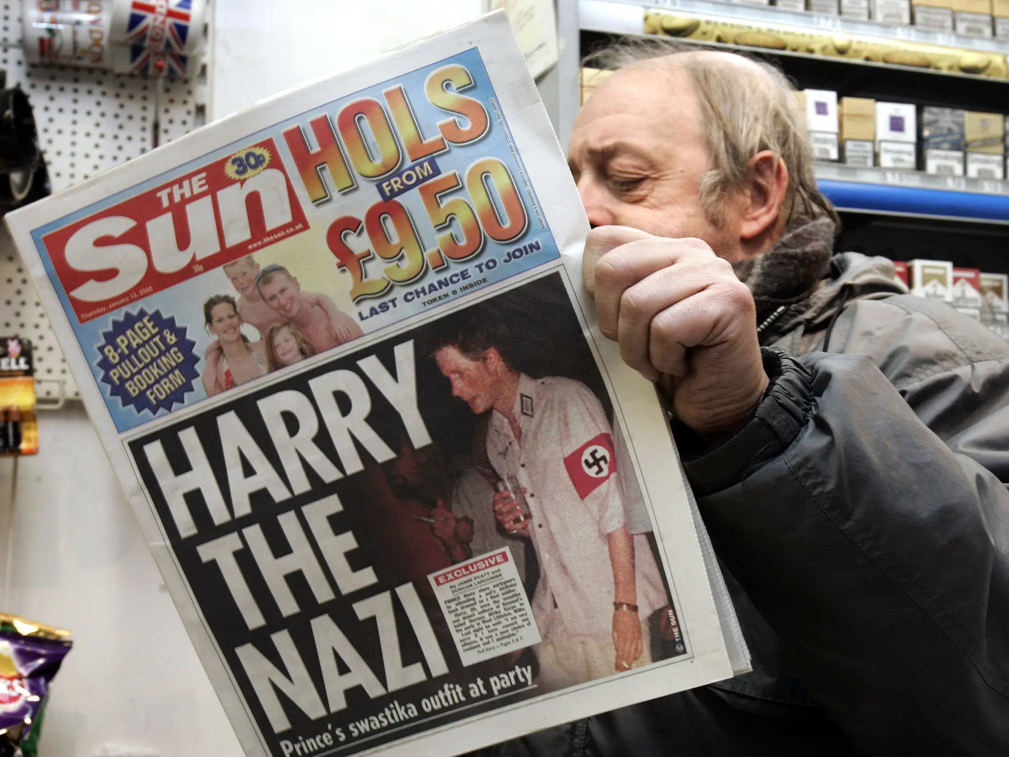 A front page article in the Sun shows Prince Harry in a Nazi costume