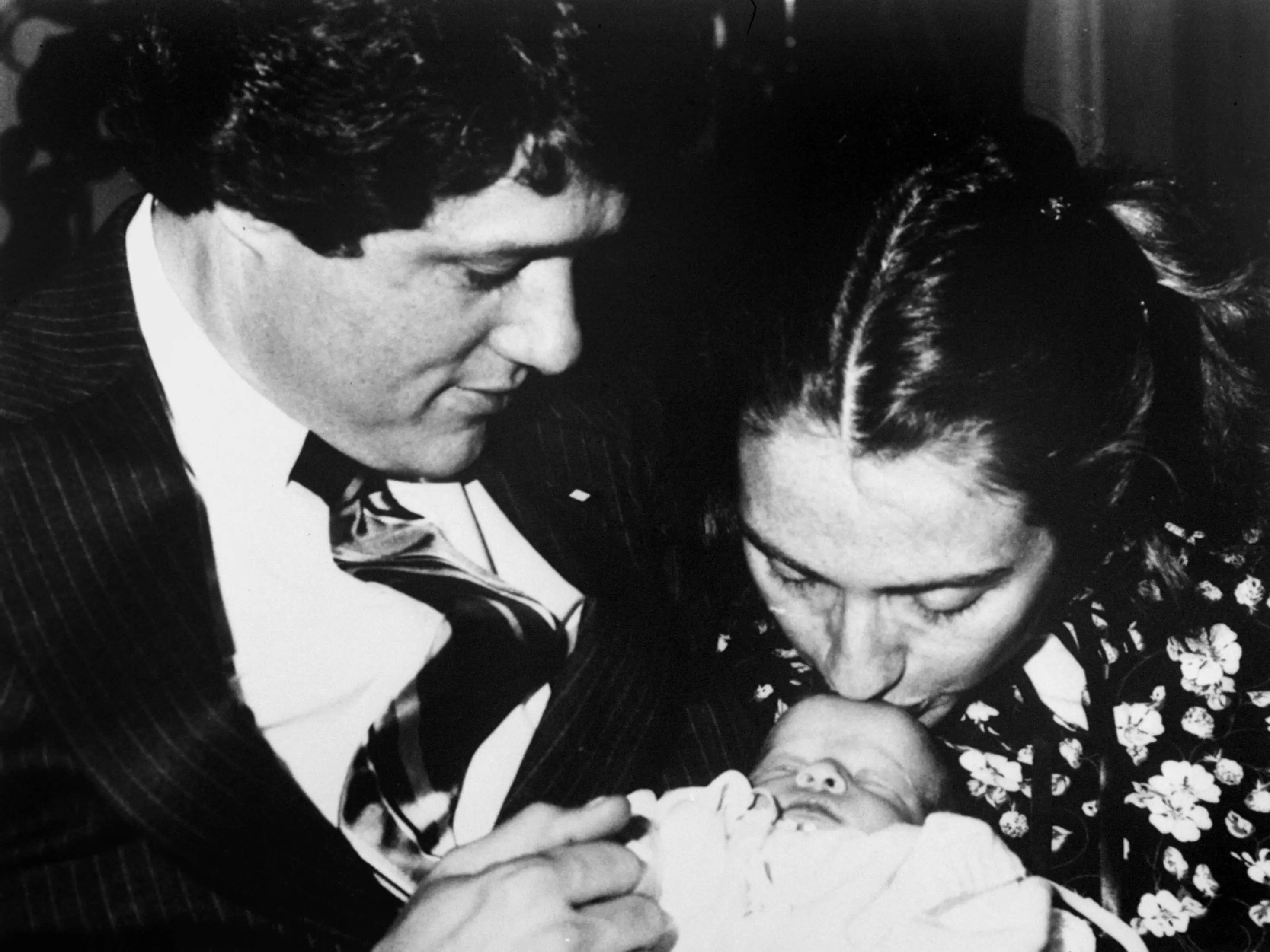 Bill Clinton and Hillary Clinton with their baby daughter, Chelsea Clinton.
