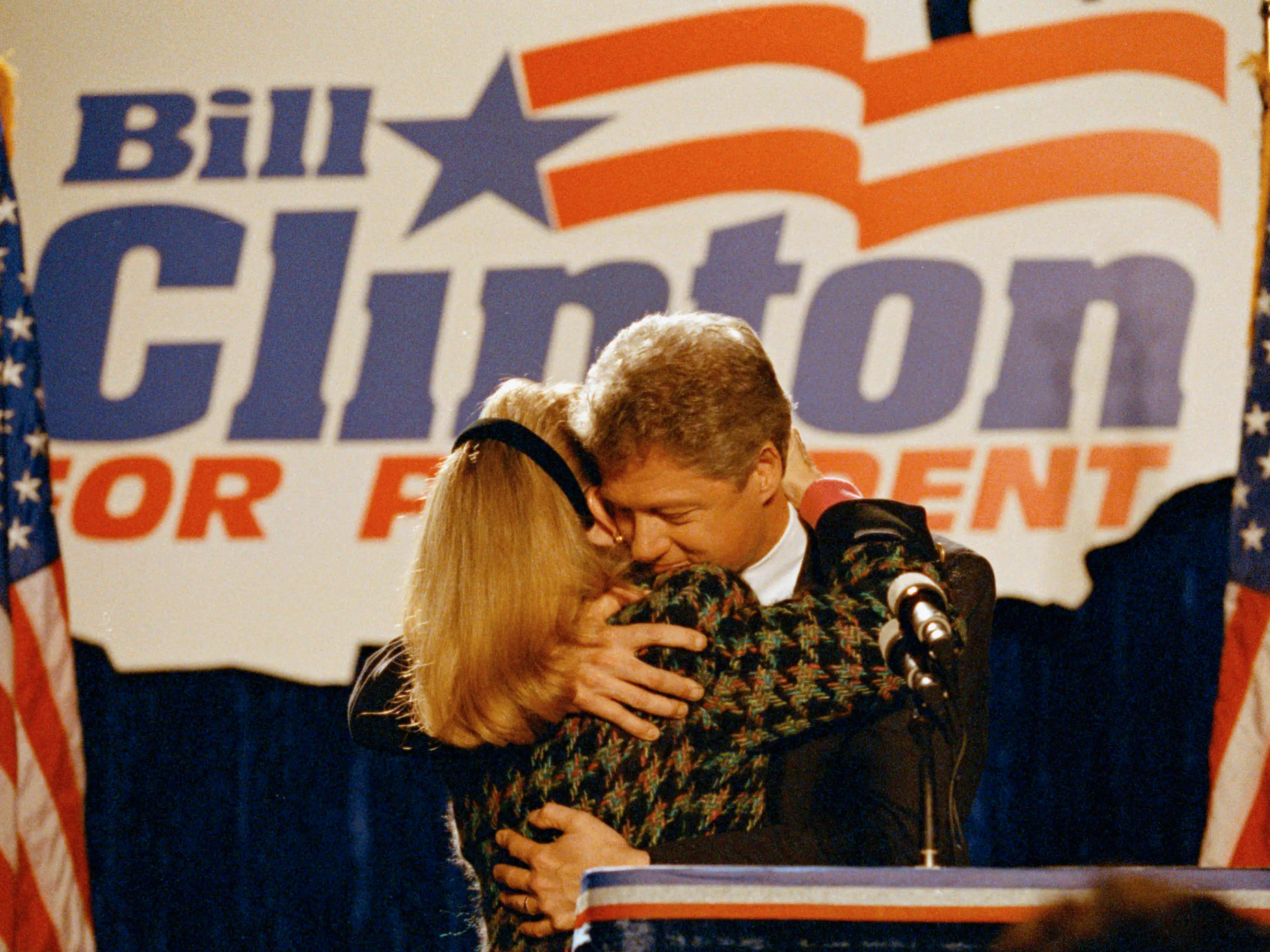 Hillary Clinton and Bill Clinton embraced at a campaign event.
