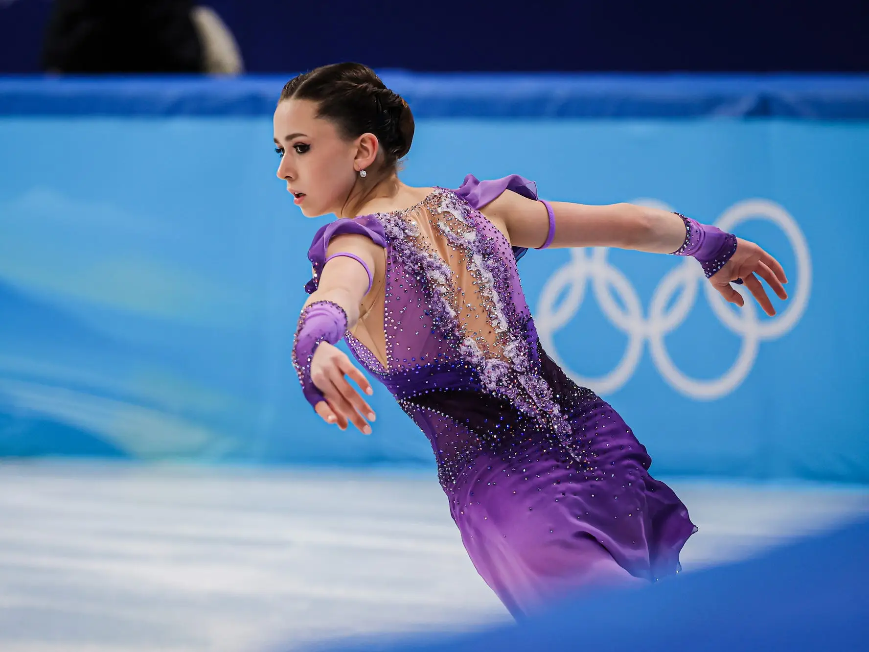Kamila Valieva of Team Russian Olympic Committee wore an ombre purple costume to compete in the Women's Single Skating Short Program during the Figure Skating Team Event.