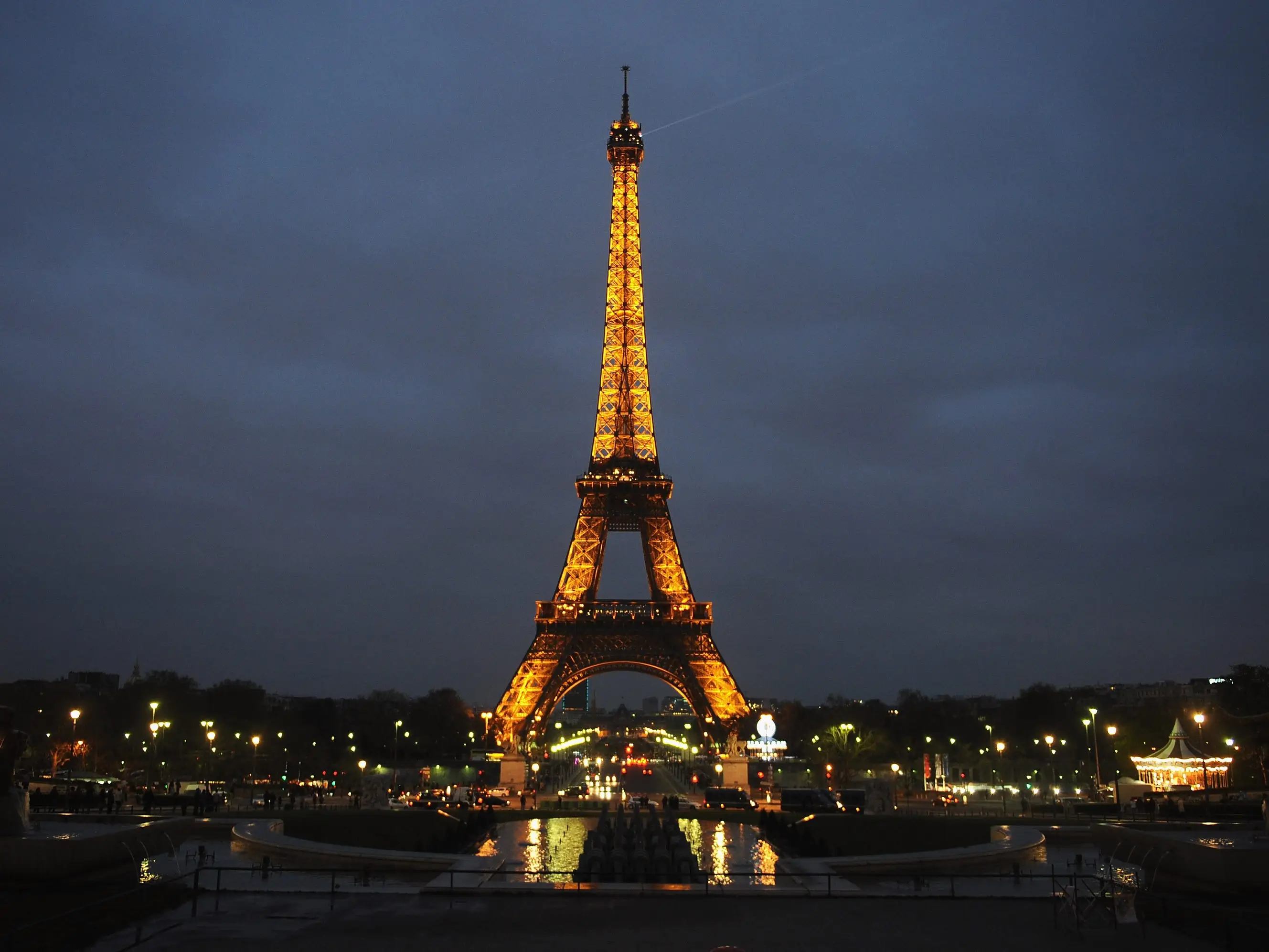 The Eiffel Tower, lit up against the night sky