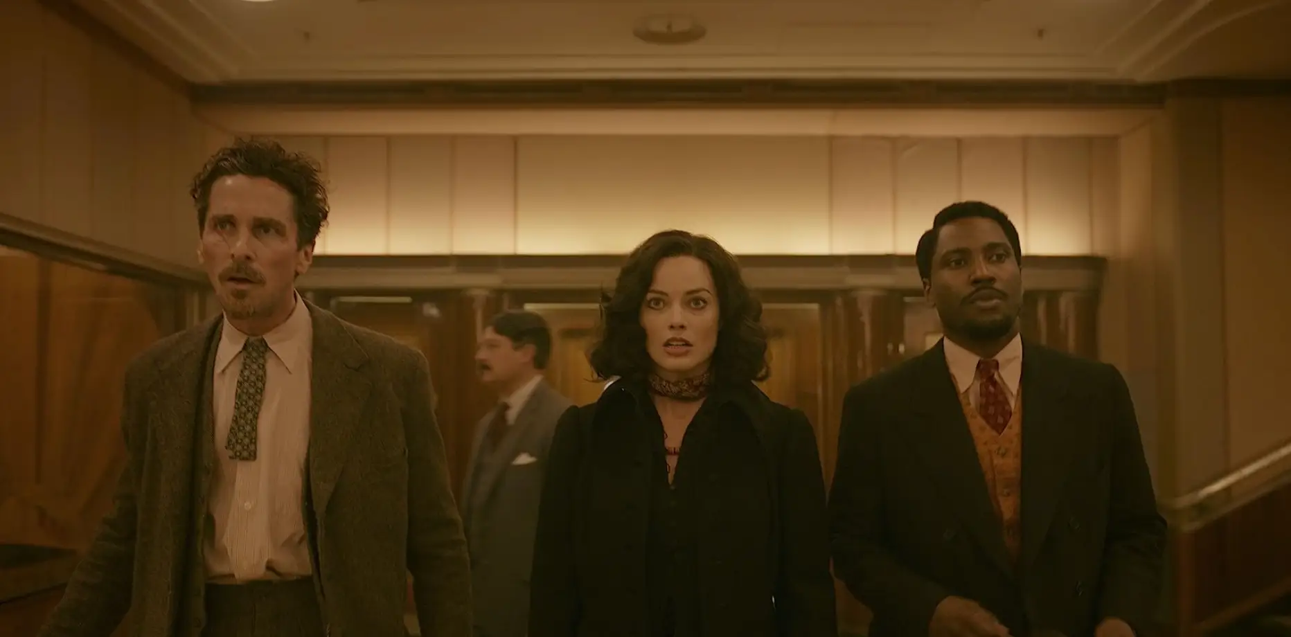 Christian Bale, Margot Robbie, and John David Washington in 