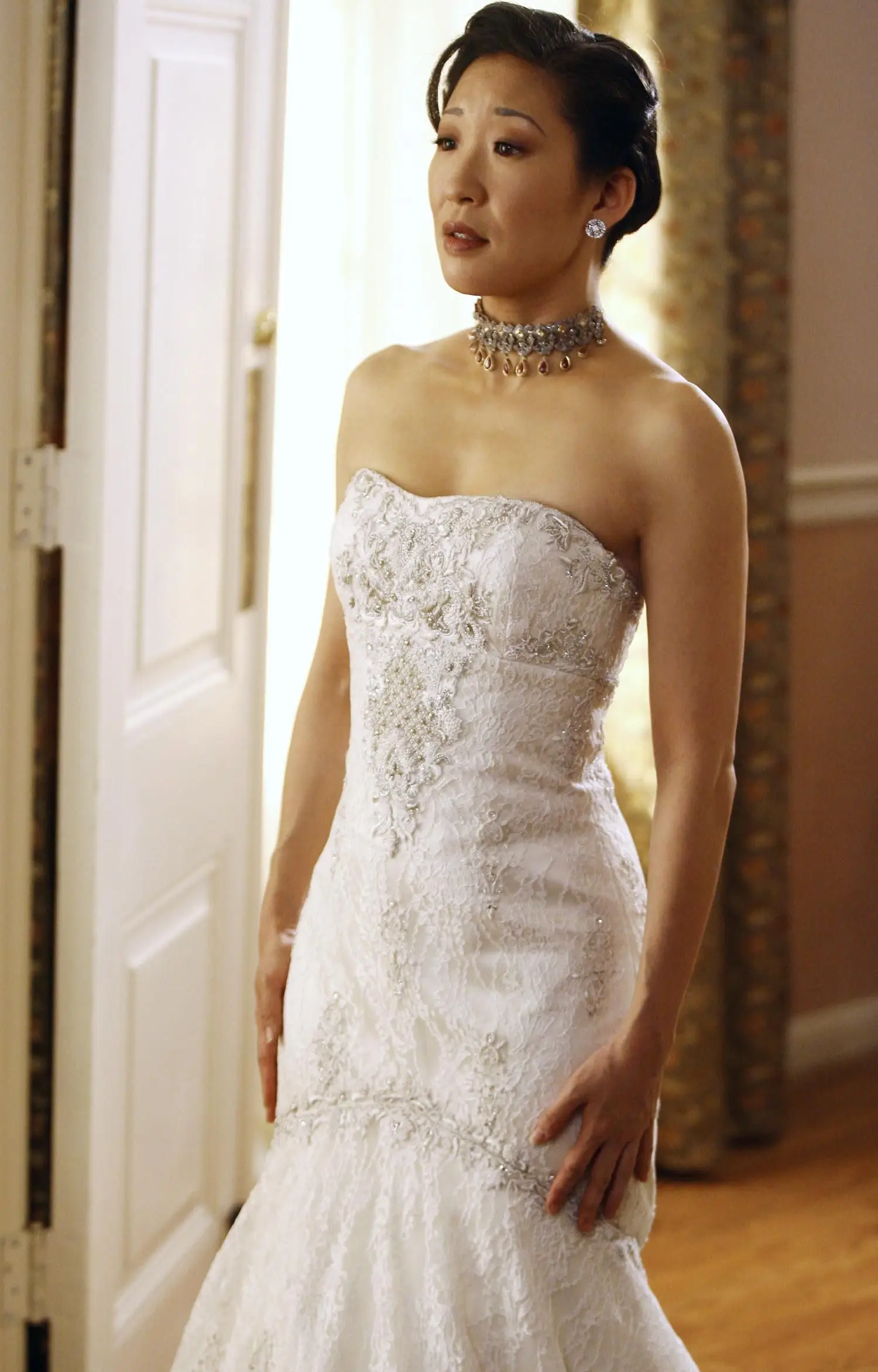 Christina Yang stands in a wedding dress on 