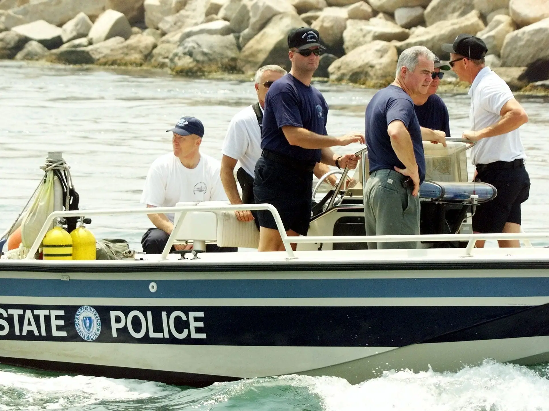 Massachusetts State Police divers left Menemsha on Martha's Vineyard on July 19, 1999.