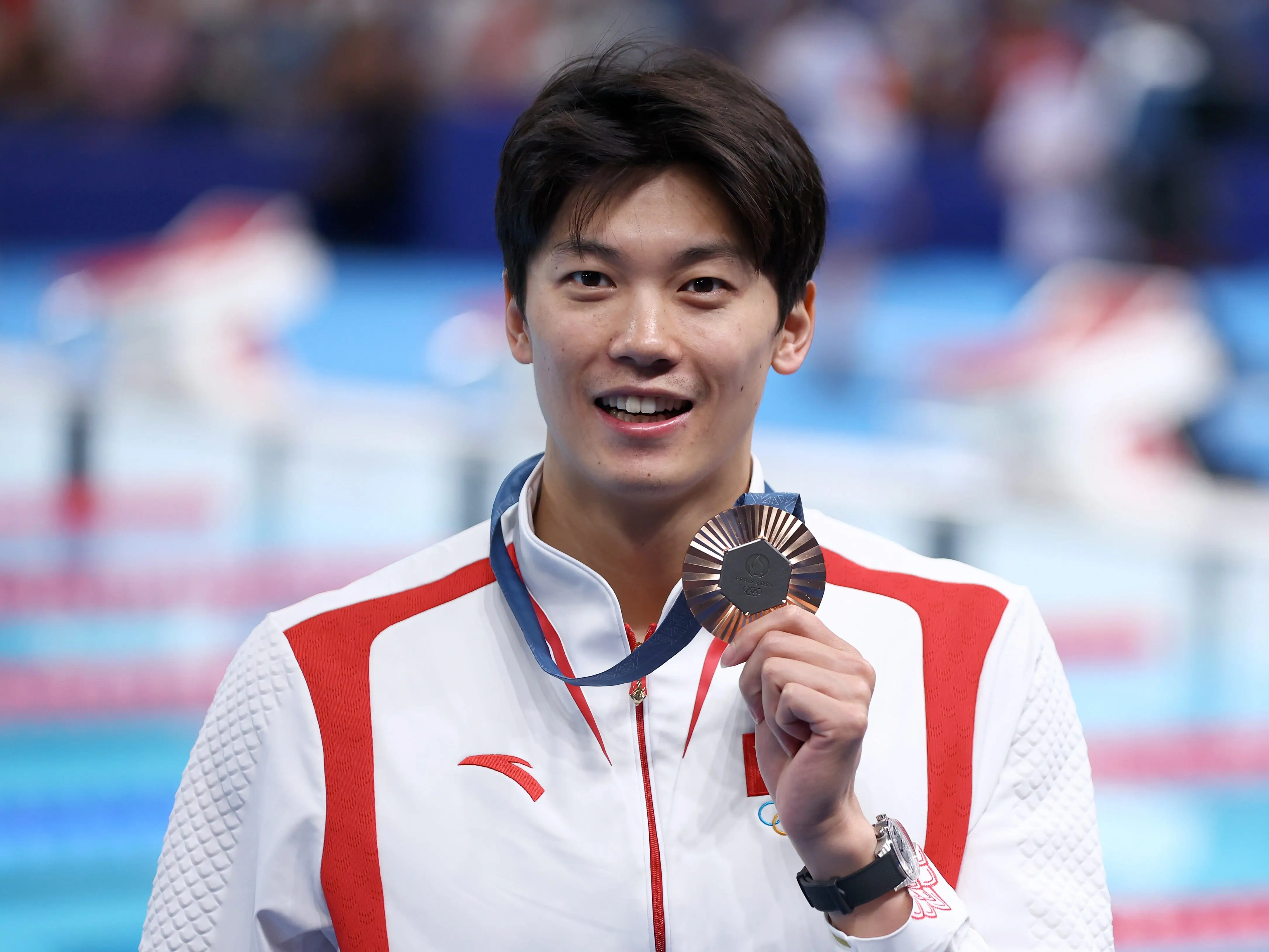 Wang Shun of Team People's Republic of China posed with his bronze medal after the men's 200-meter individual medley in Paris.
