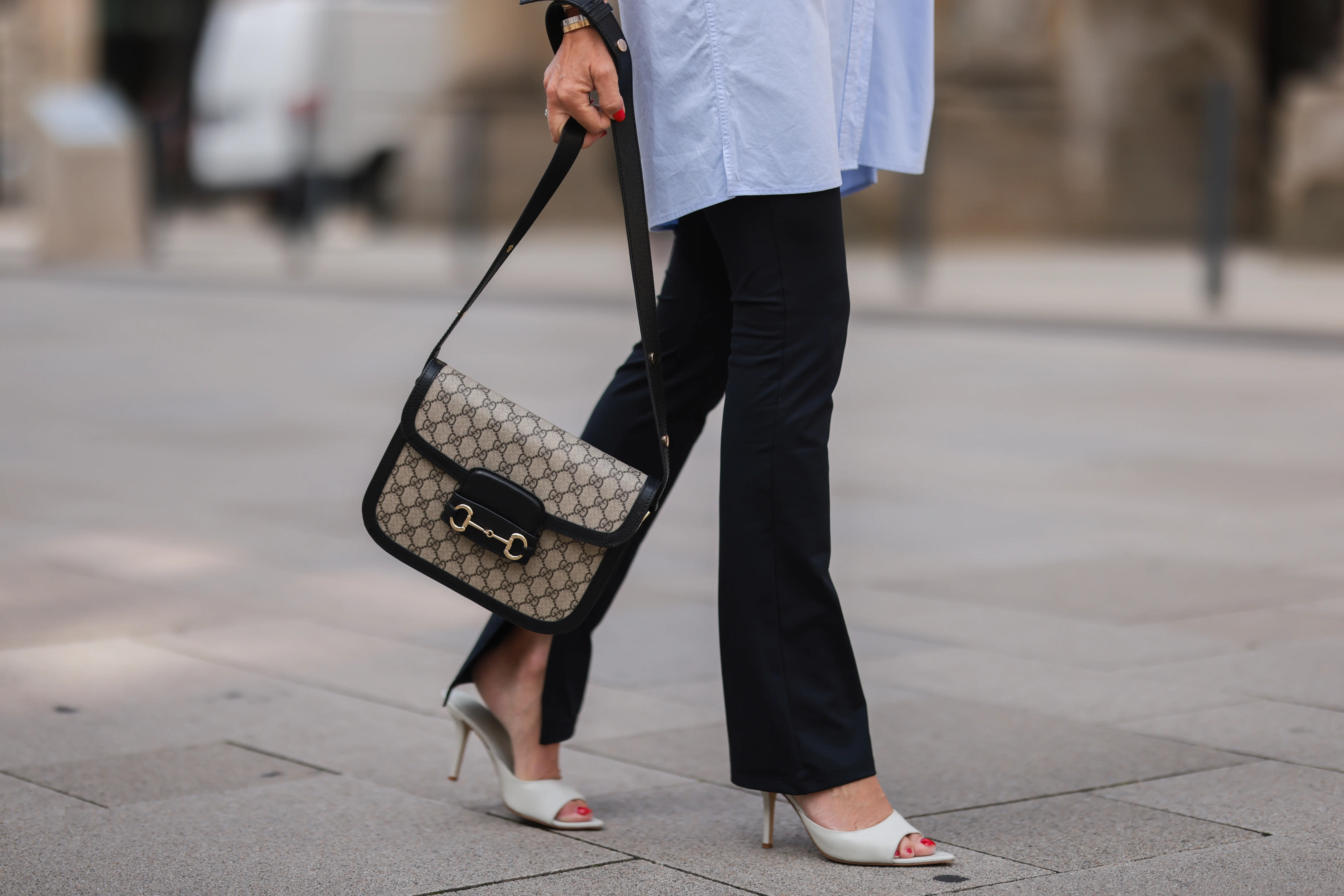 A black leather canvas Gucci Horsebit bag.