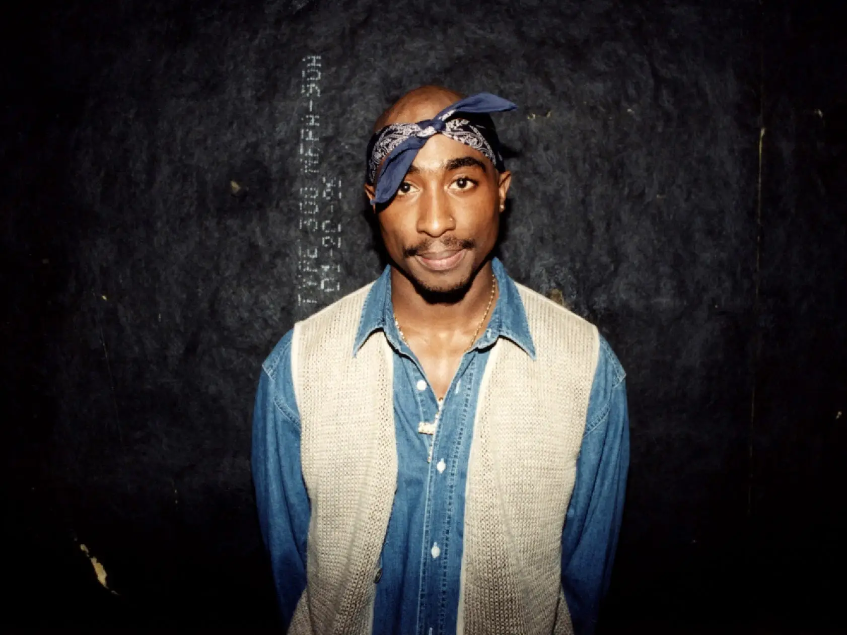 Rapper Tupac Shakur poses for photos backstage after his performance at the Regal Theater in Chicago, Illinois in March 1994.