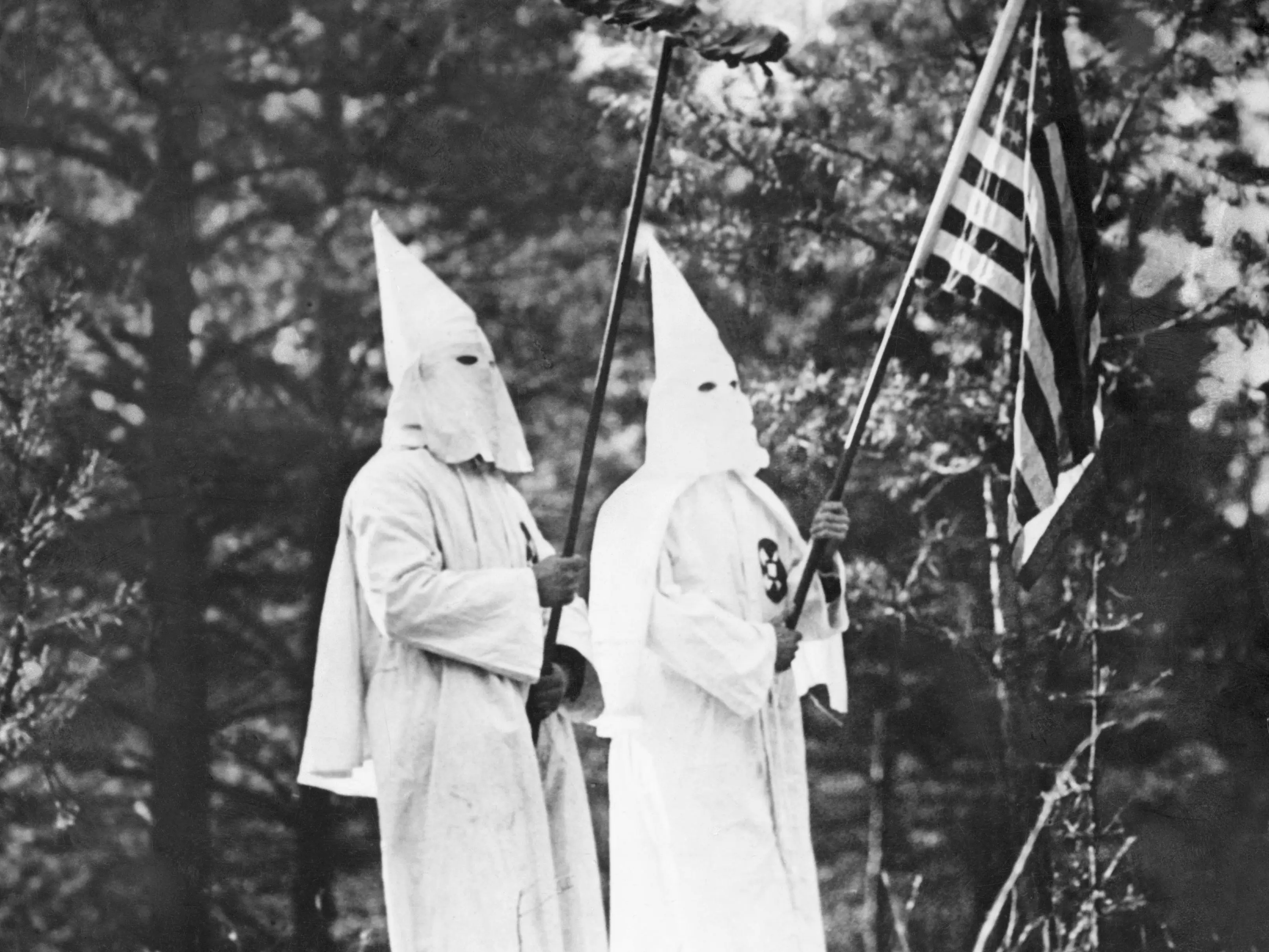 Two Ku Klux Klansmen with American Flag and Burning Cross