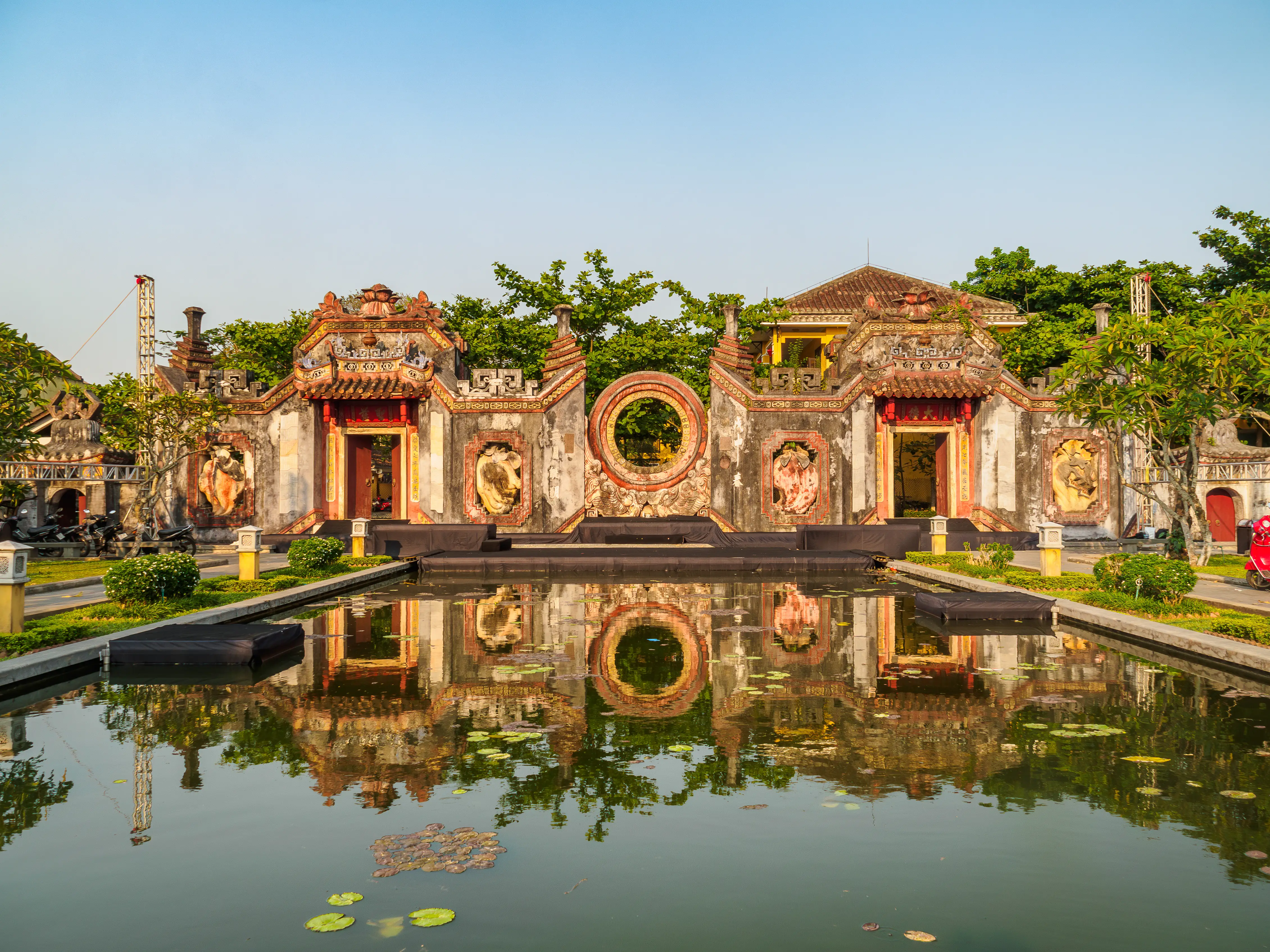 The reflection of a Vietnamese gate in water.