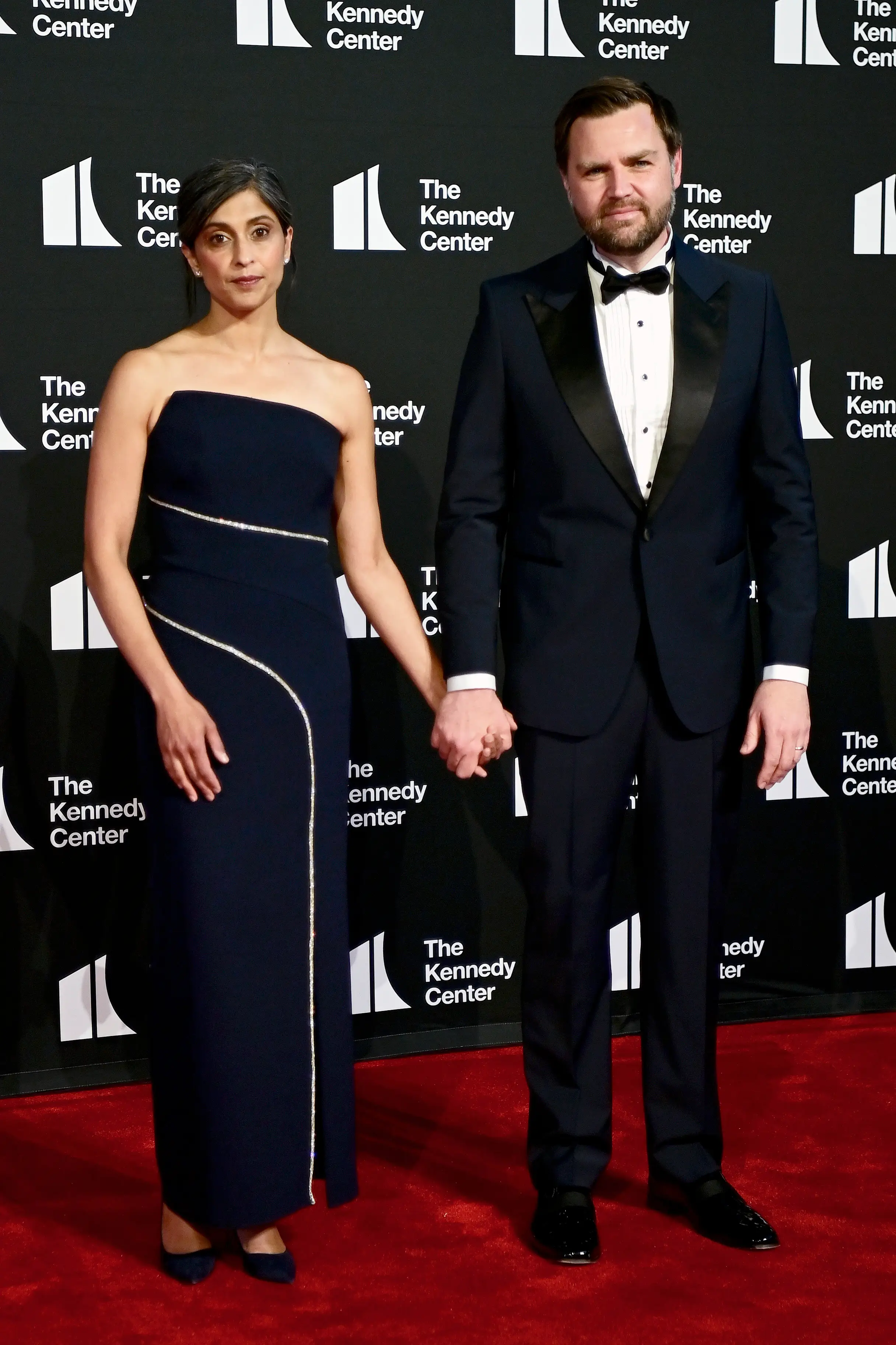 Usha Vance and JD Vance hold hands on the red carpet at the Kennedy Center.