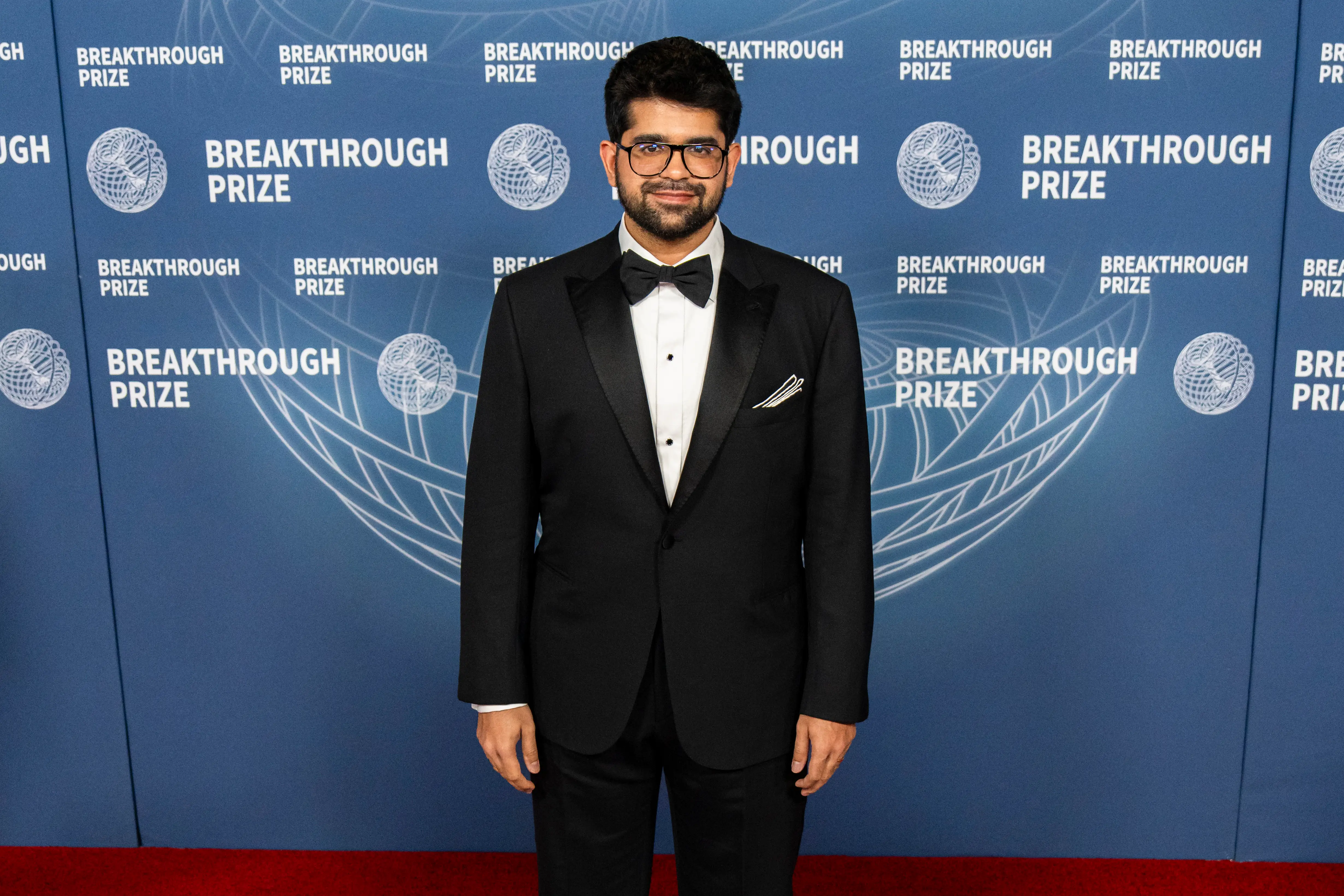 Aravind Srinivas on a red carpet at an awards event.