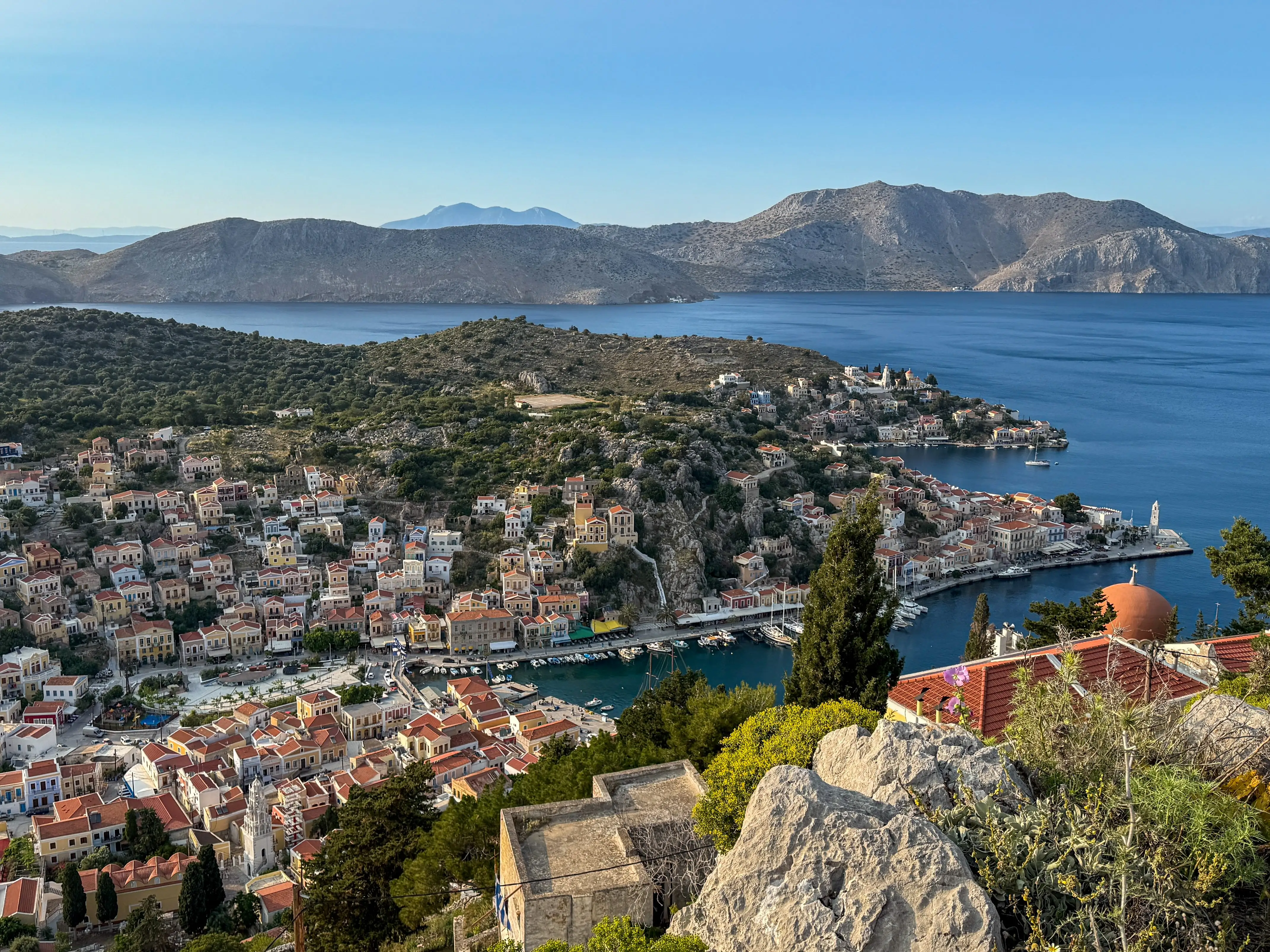 An overhead view of Symi, with rows of vibrant, colorful buildings.