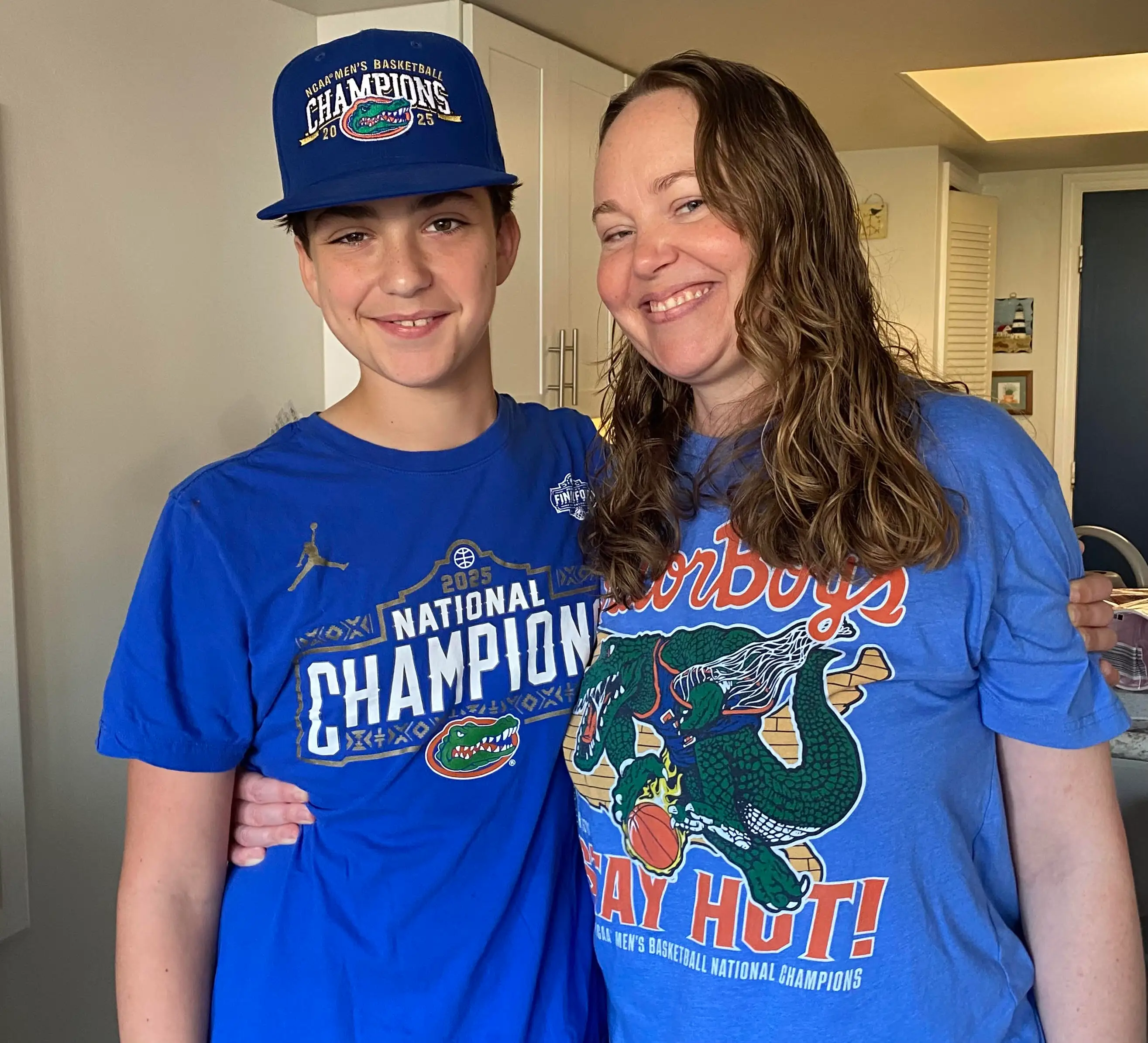 The author with her son, both wearing Gator's Basketball merch.