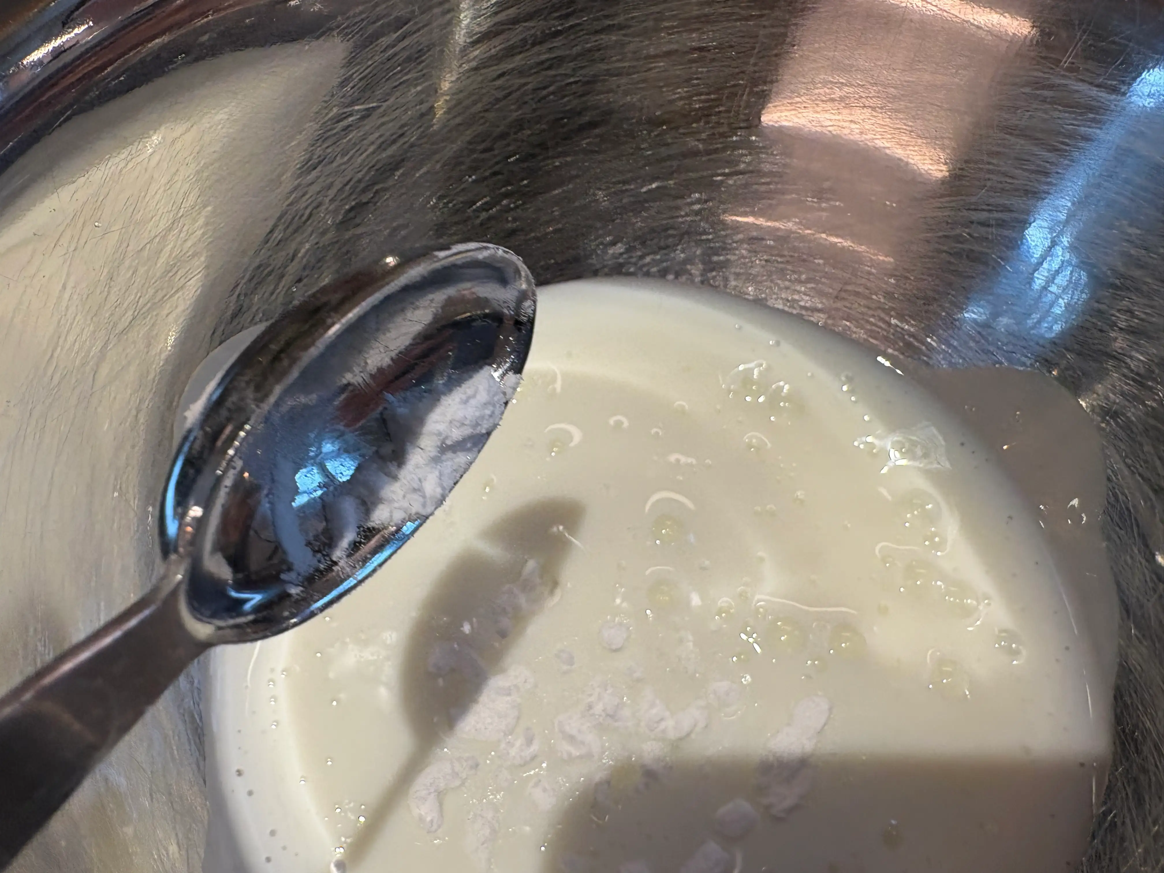 The buttermilk and baking soda being mixed together.