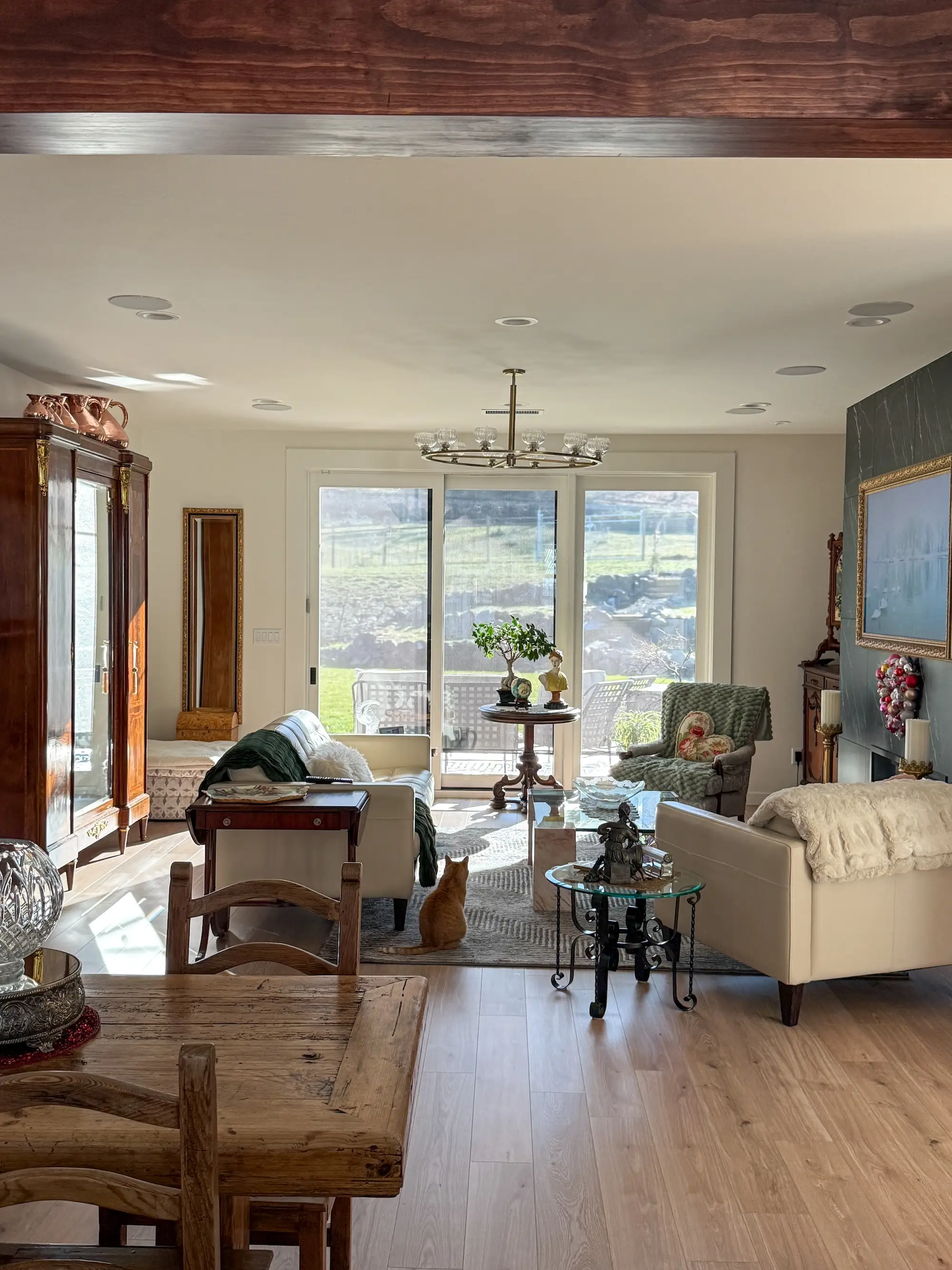 A living room with sliding glass doors that lead to a backyard.