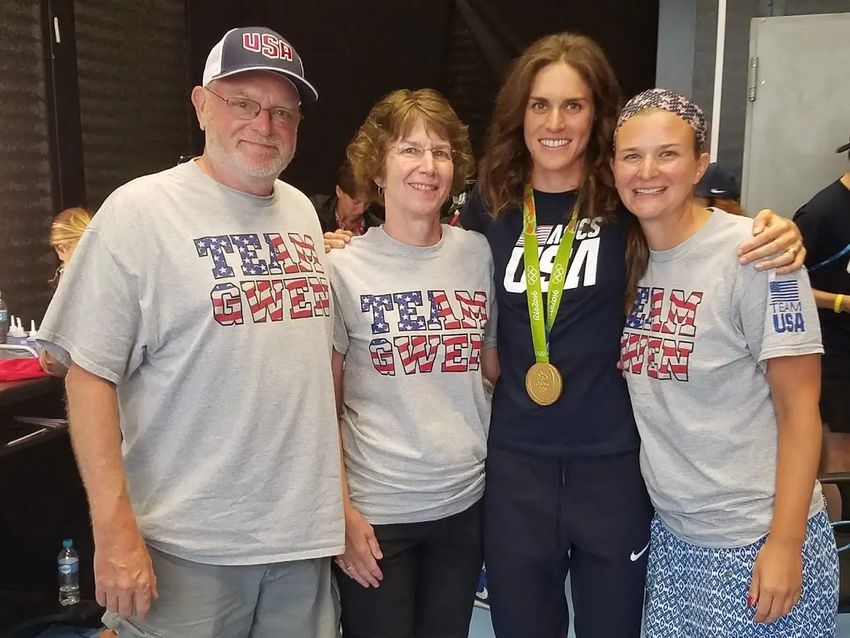 The author, second from left, posing with her family after her daughter's Olympic gold medal win.
