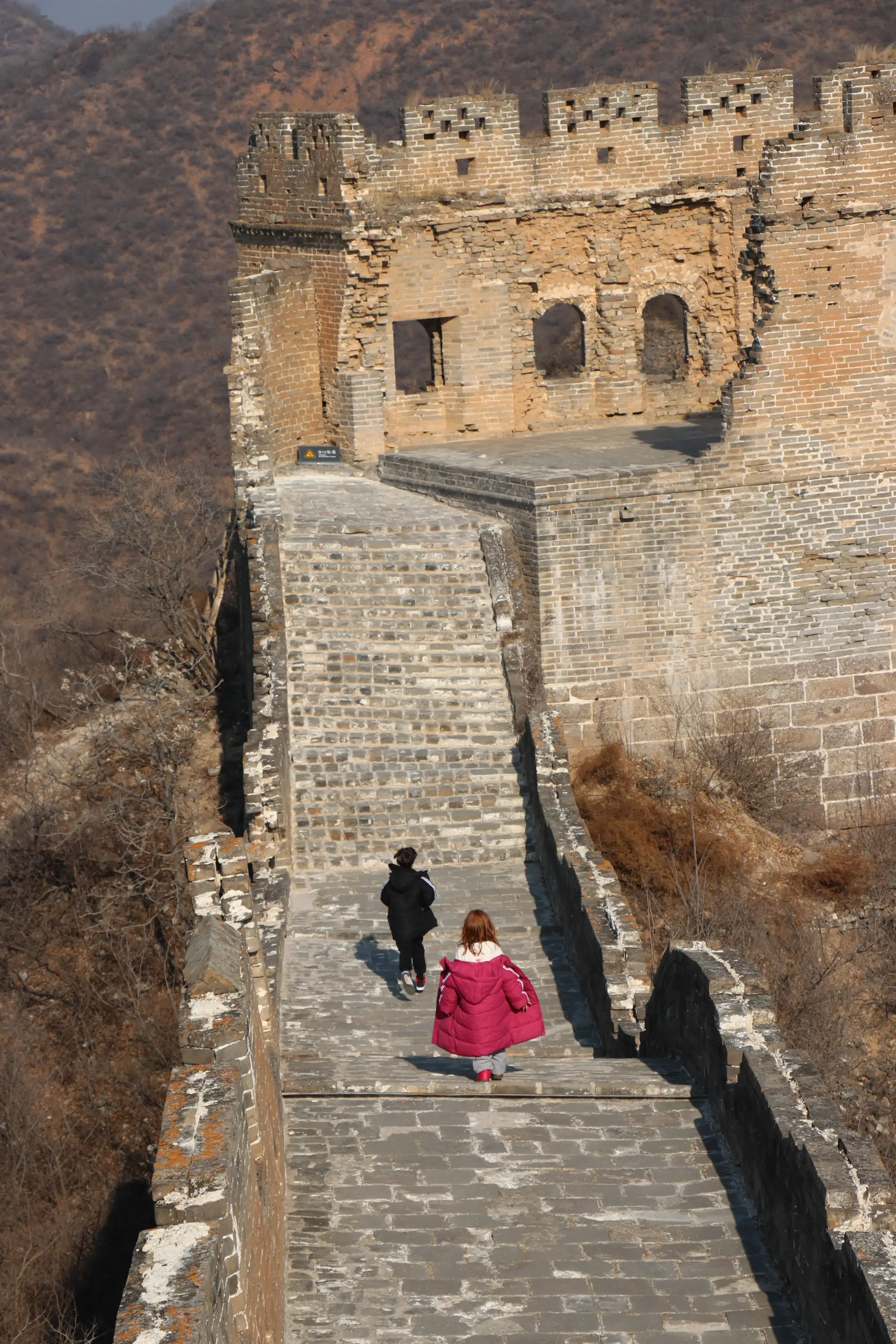 Two kids along the Great Wall of China.