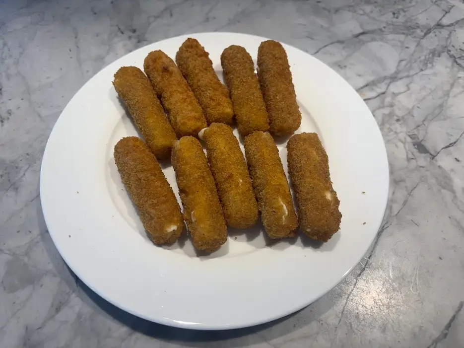 Mozarella sticks on white plate