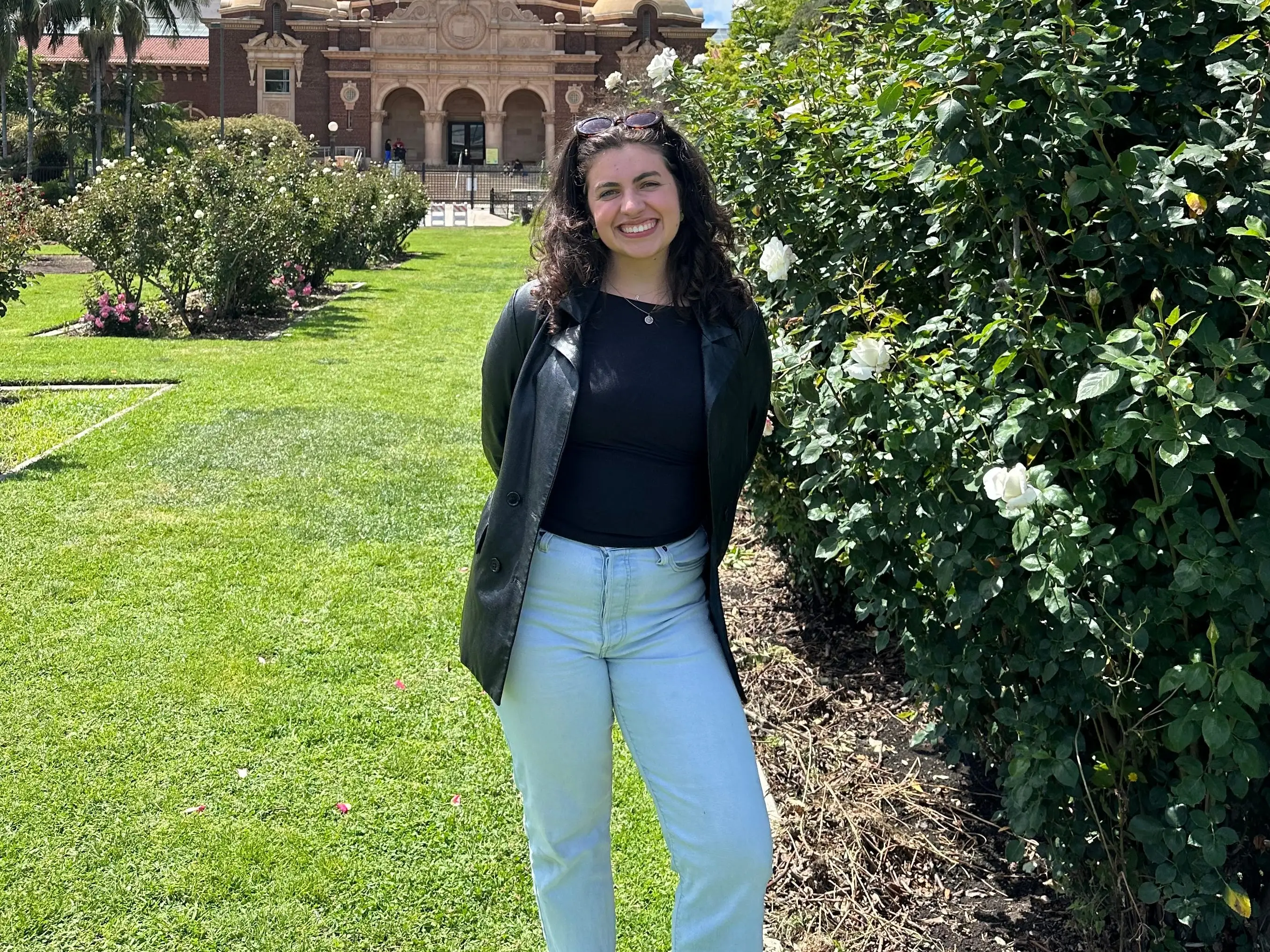 The author posing in a garden.