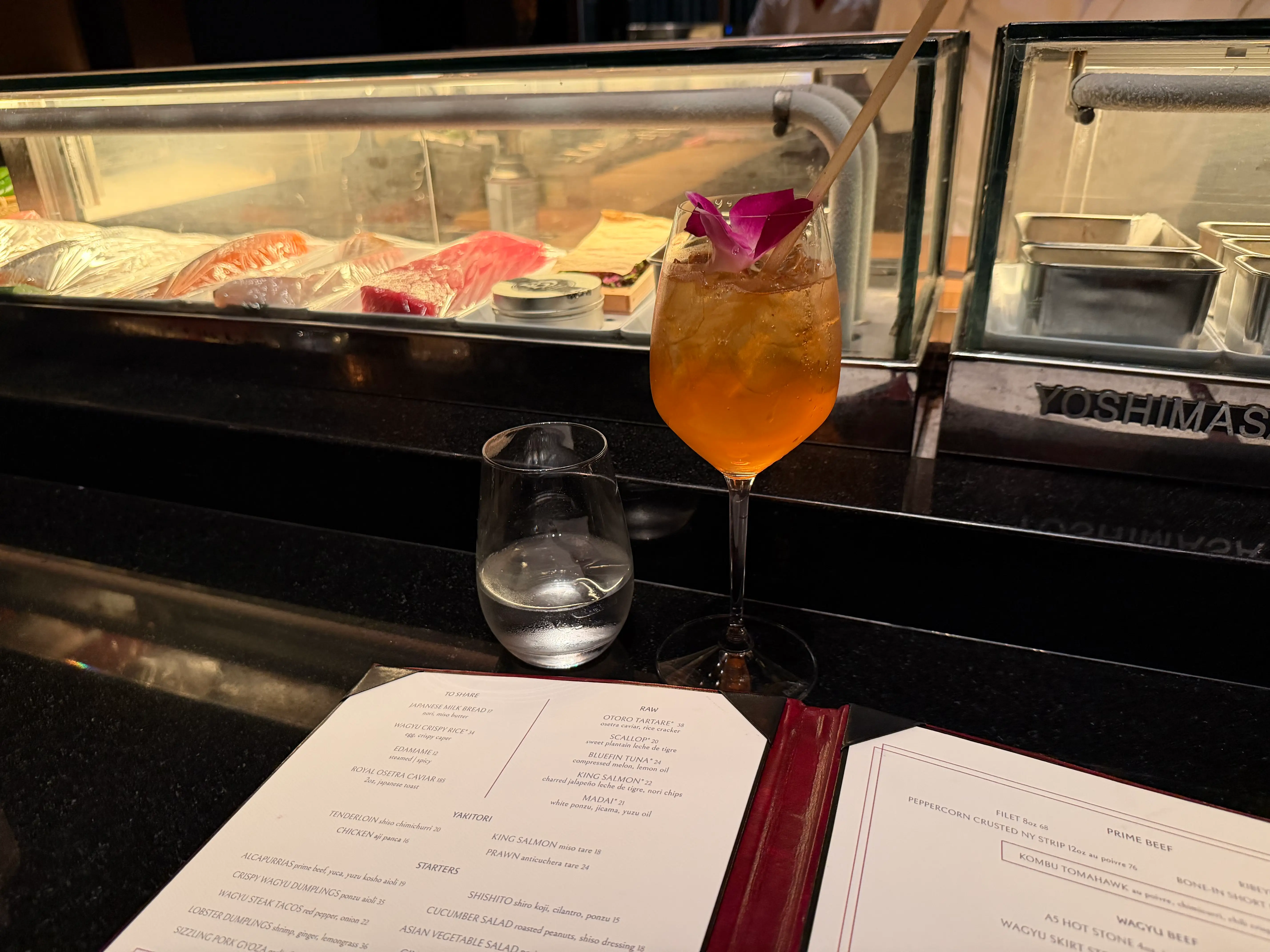 Drink, menu, and counter at Bad Bunny's Gekko restaurant in Miami