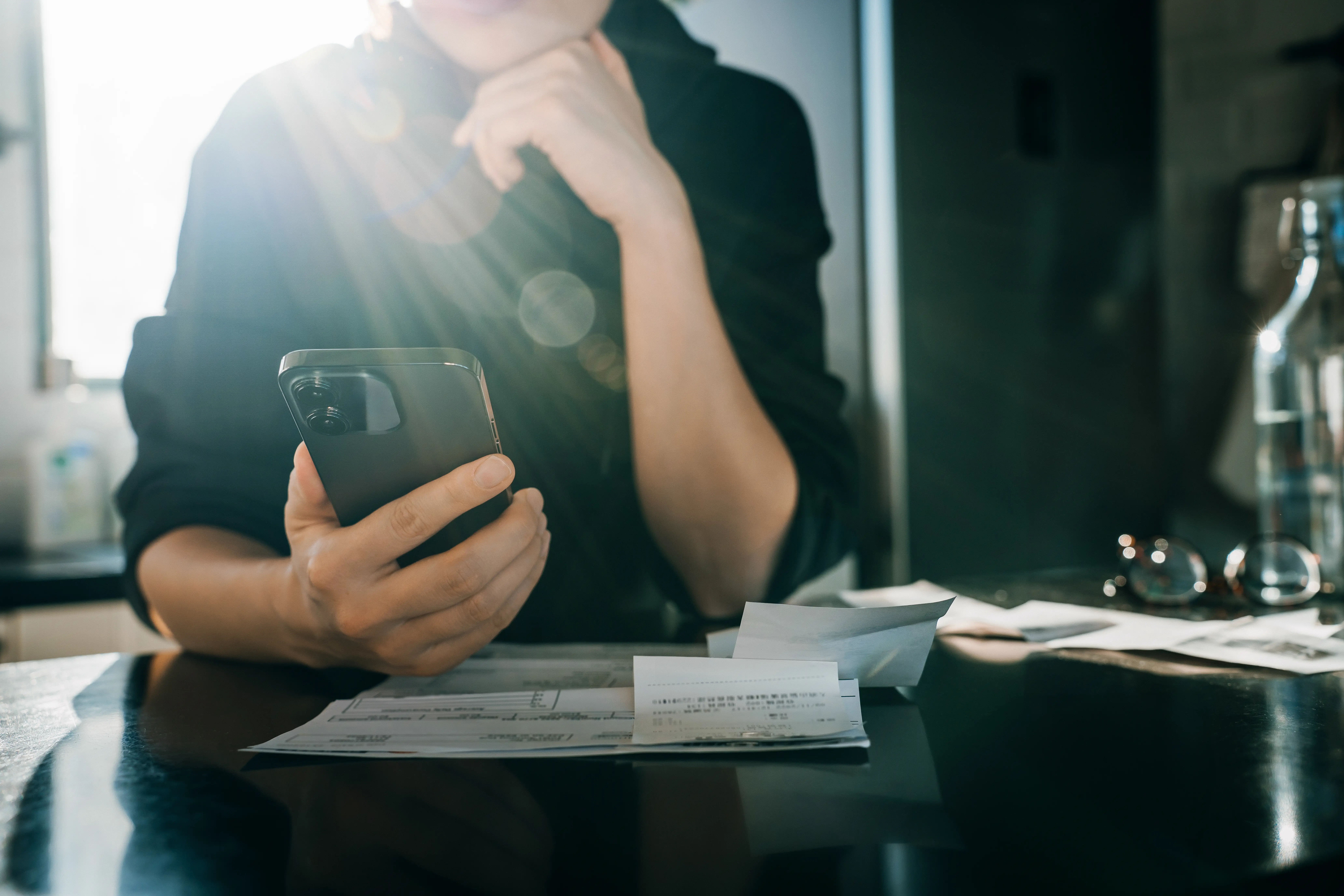 A woman looking at her phone