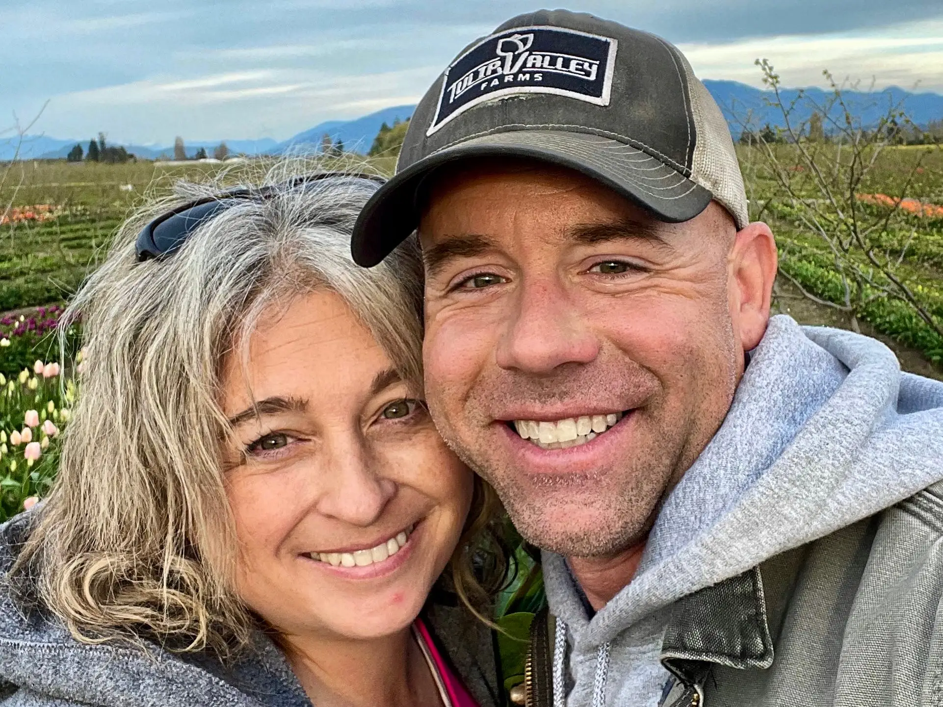 Andrew Miller and his wife Holly on Tulip Farms in Washington.