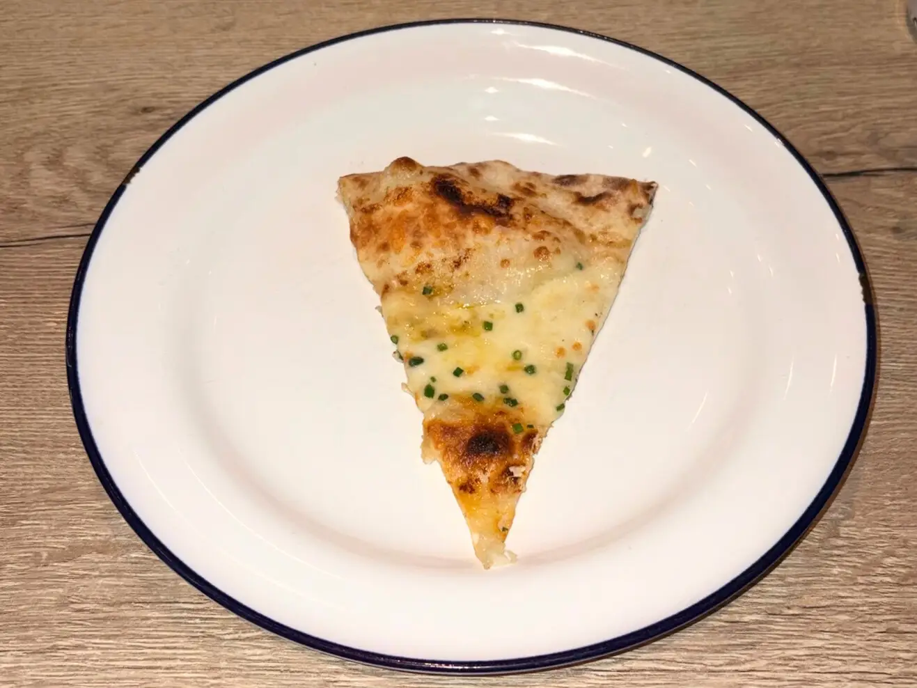The Cinque Formaggi slice at Gordon Ramsay's pizza restaurant in Dubai.