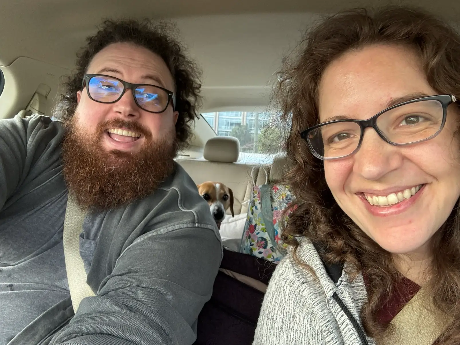 The writer's brother driving her from Houston to Canada, with a dog visible in the backseat.
