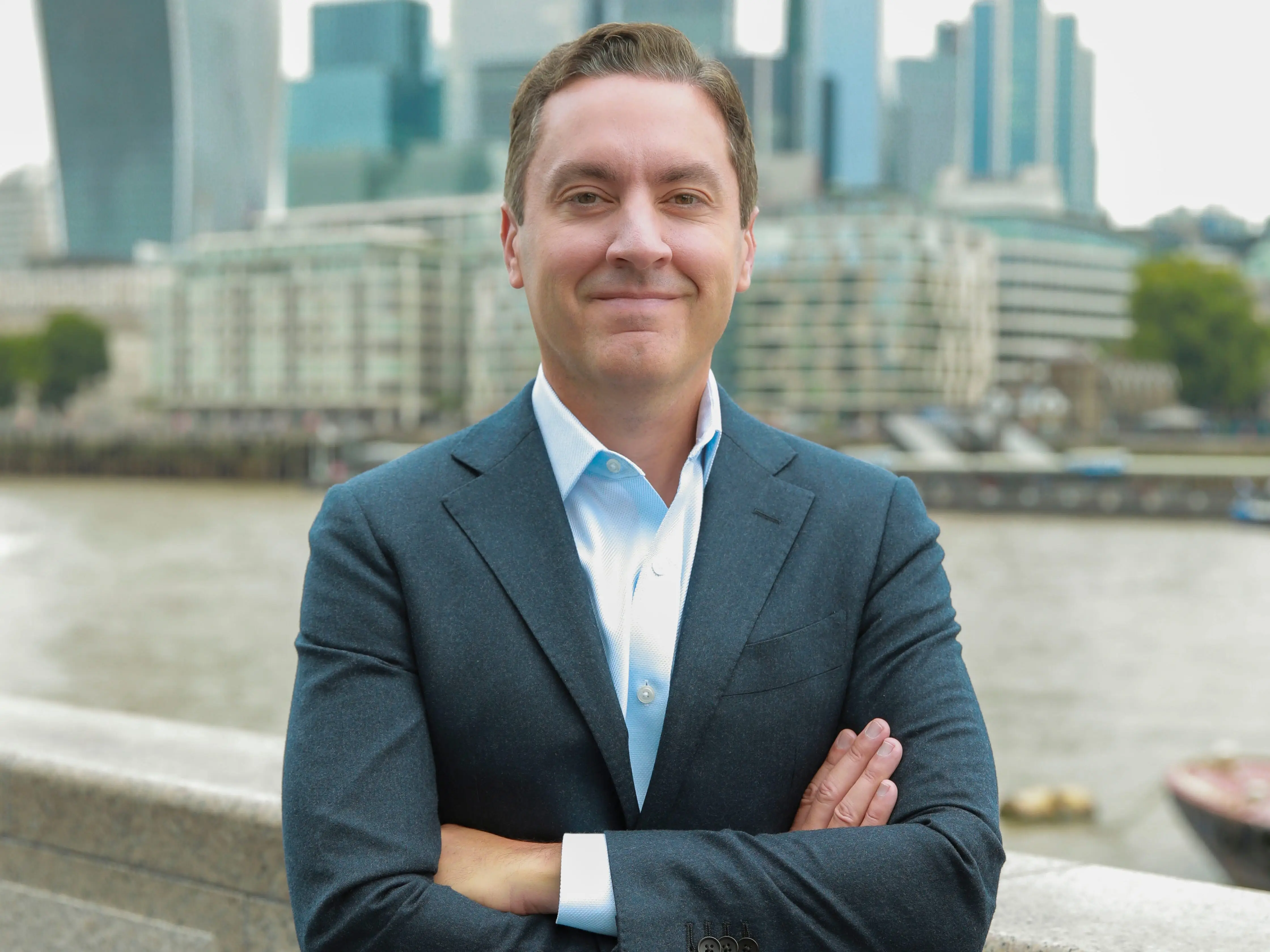 Joe Depa smiling with arms crossed