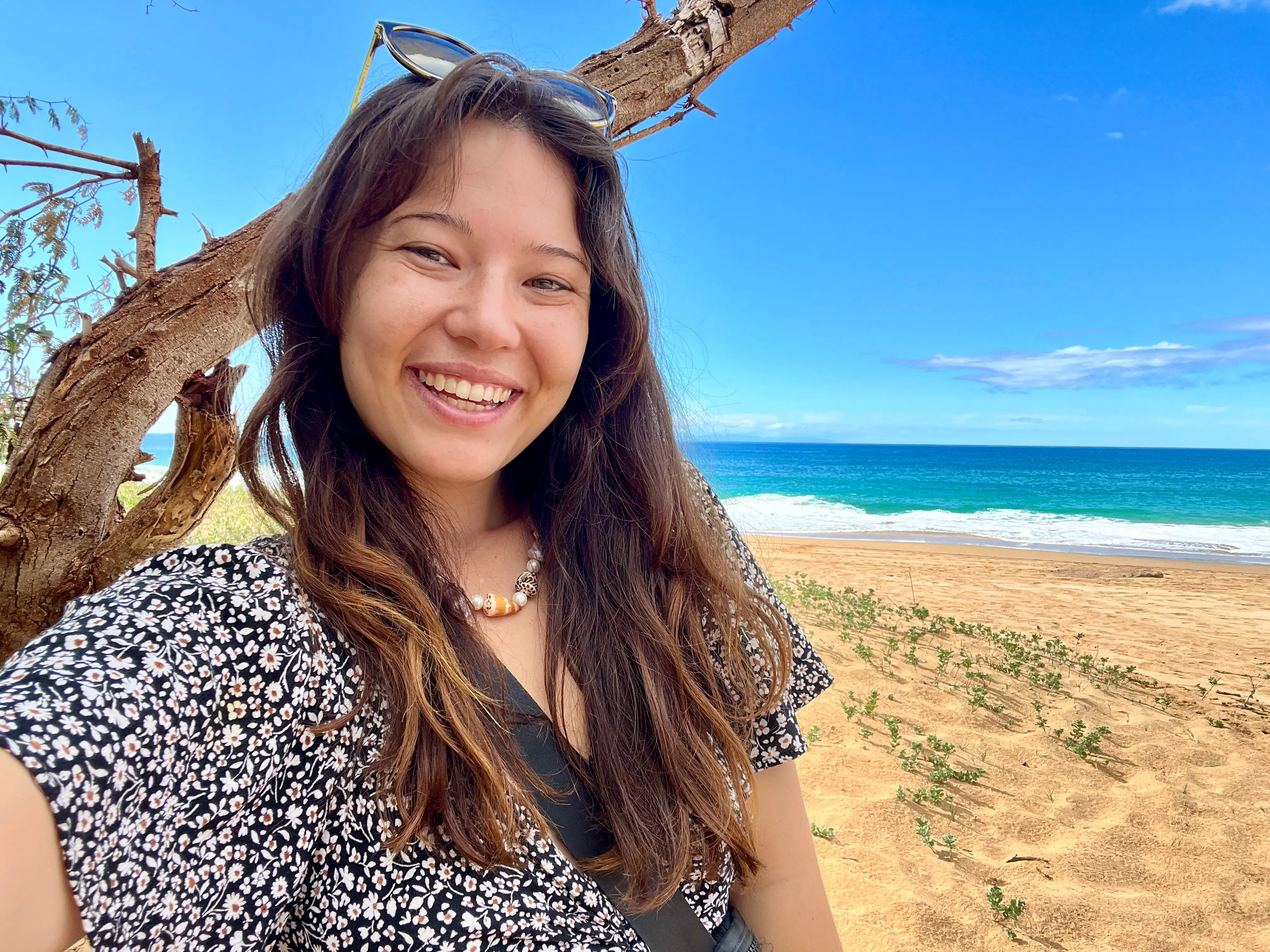 Author Ashley Probst smiling on beach in Hawaii