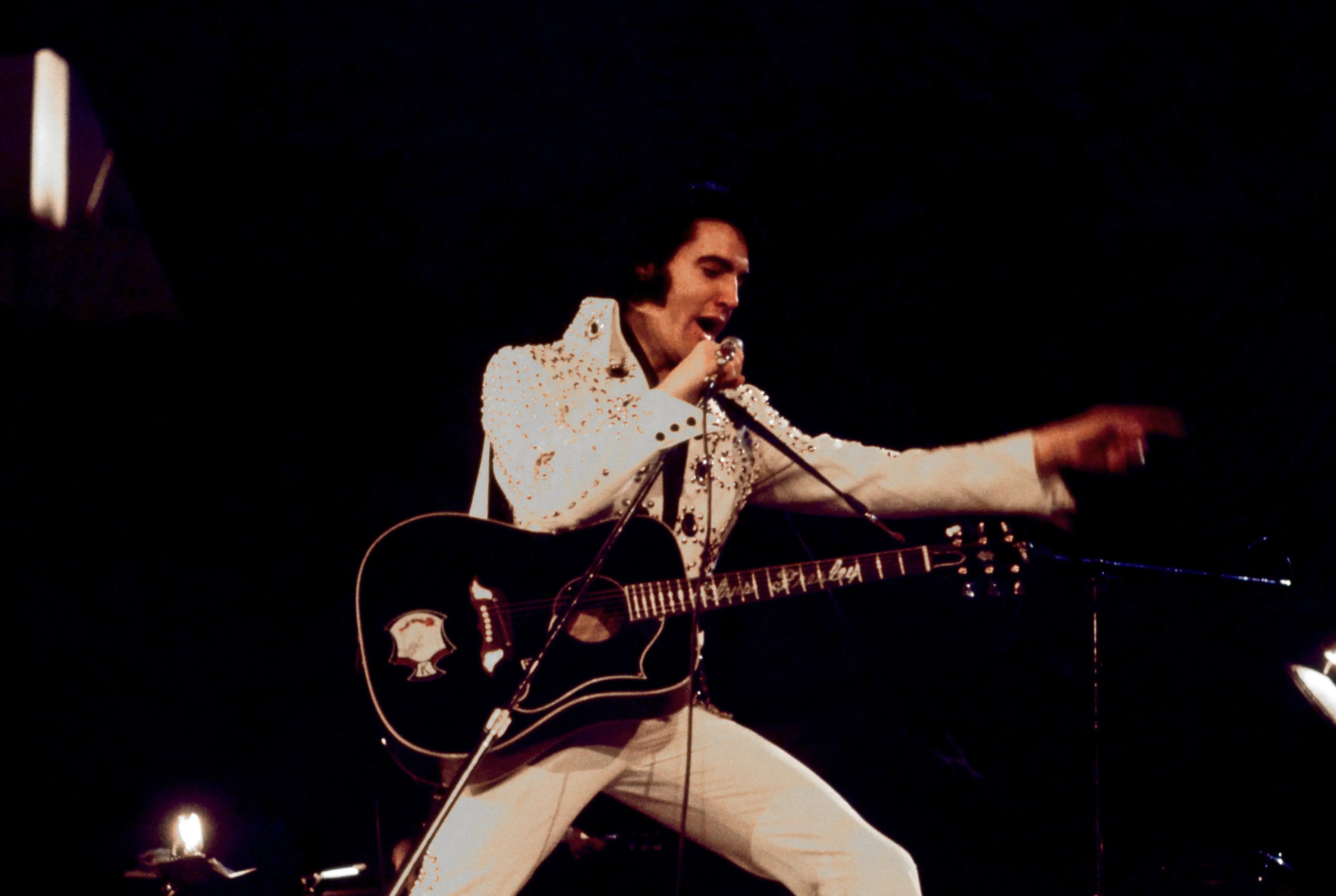 Elvis Presley performs onstage circa 1970.