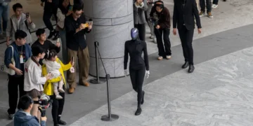 A Chinese humanoid robot flopped face-first onto the ground during a public showcase. Its CEO says it’s all part of ‘learning to walk.’