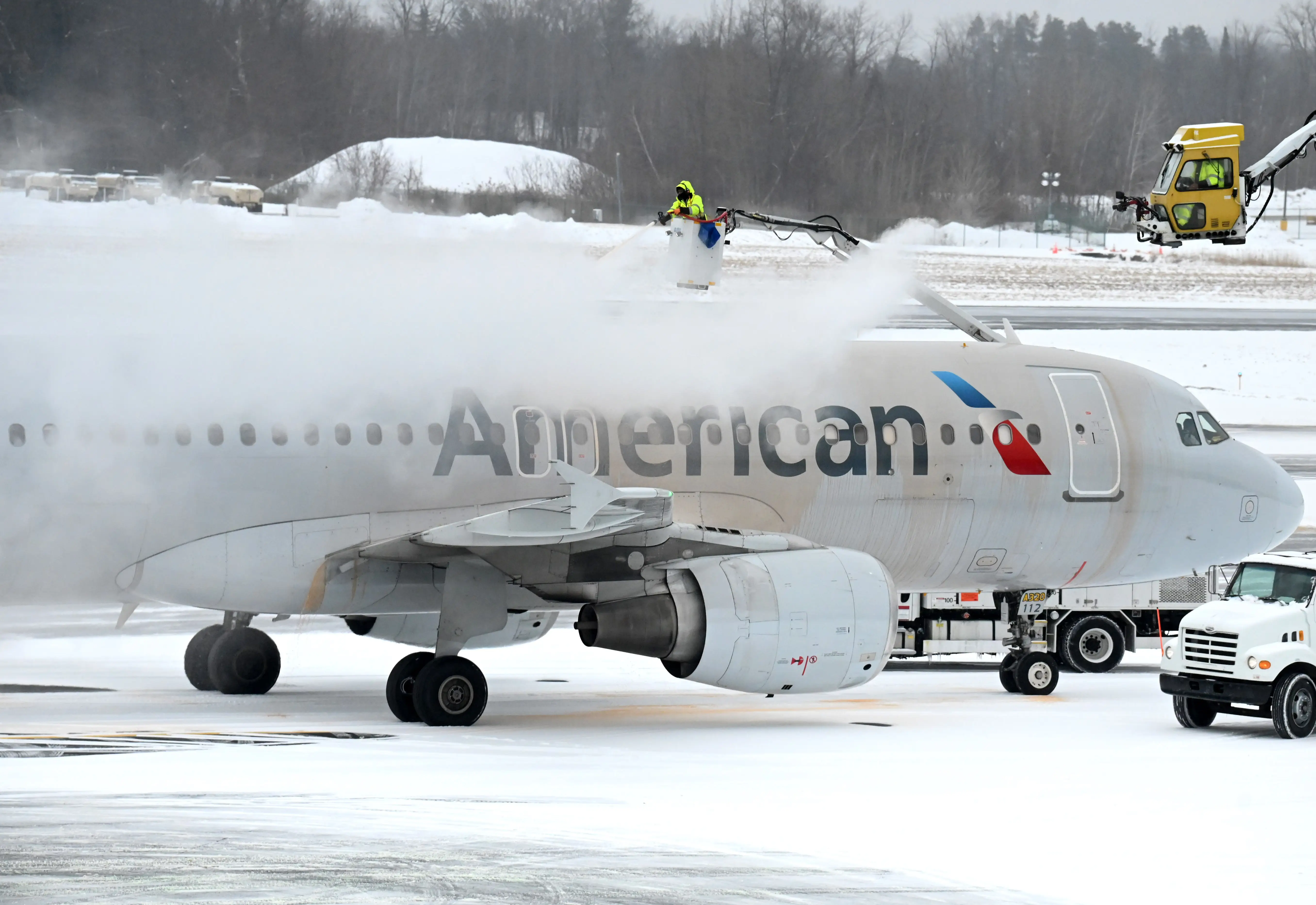 An American Airlines jet is deiced before departure on Thursday, Feb. 6, 2025, at Albany International Airport in Colonie, N.Y.