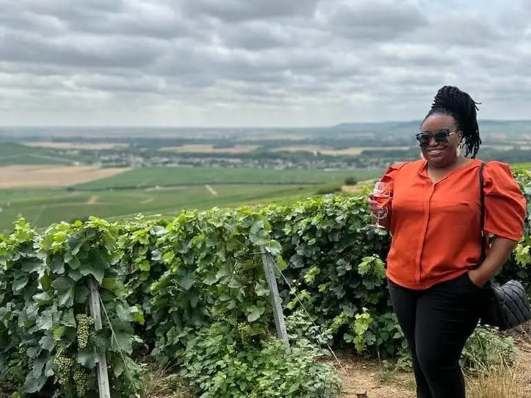 Woman smiling at vineyard